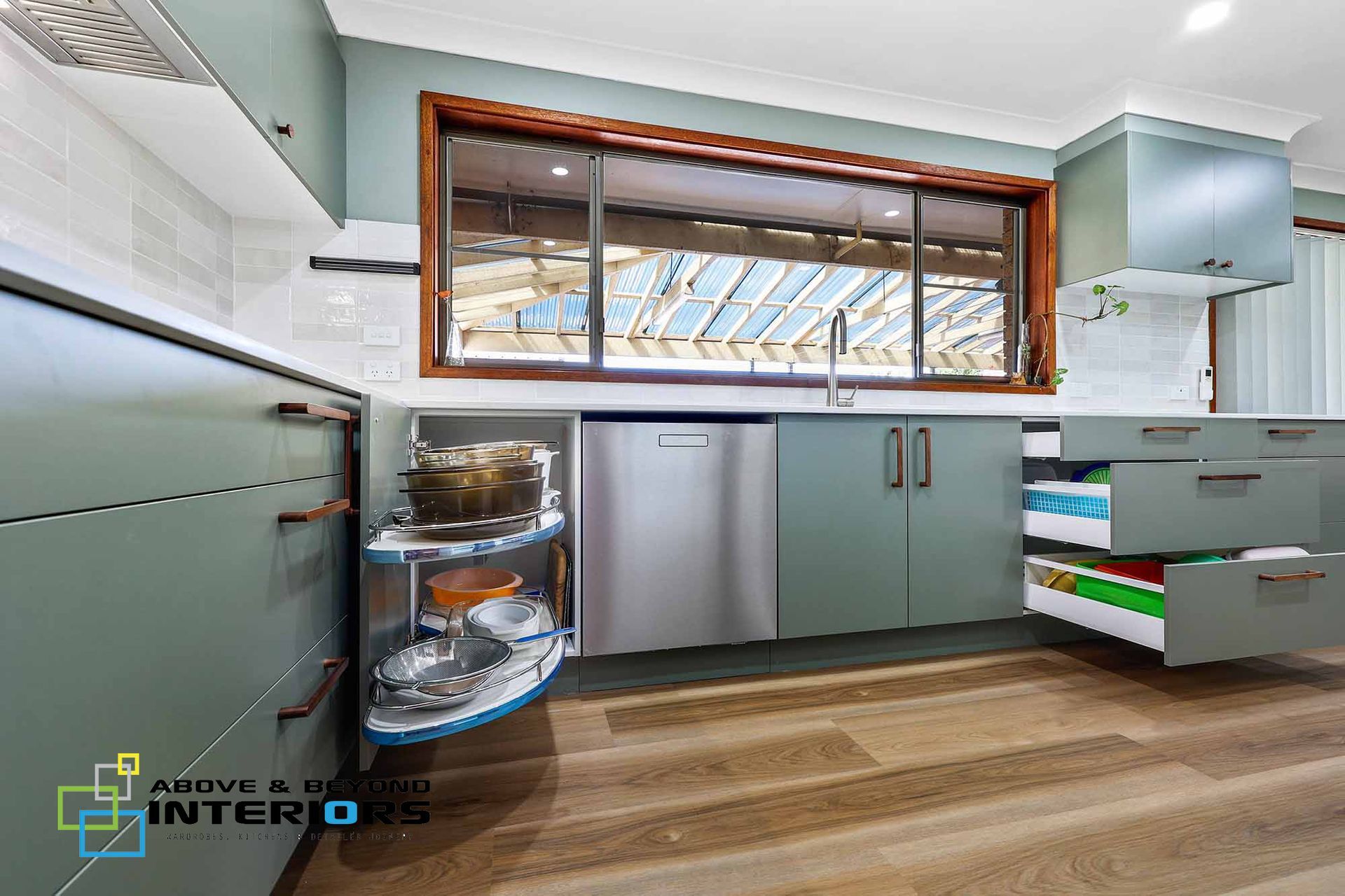 A Kitchen with Cabinets — Above & Beyond Interiors in Smeaton Grange, NSW