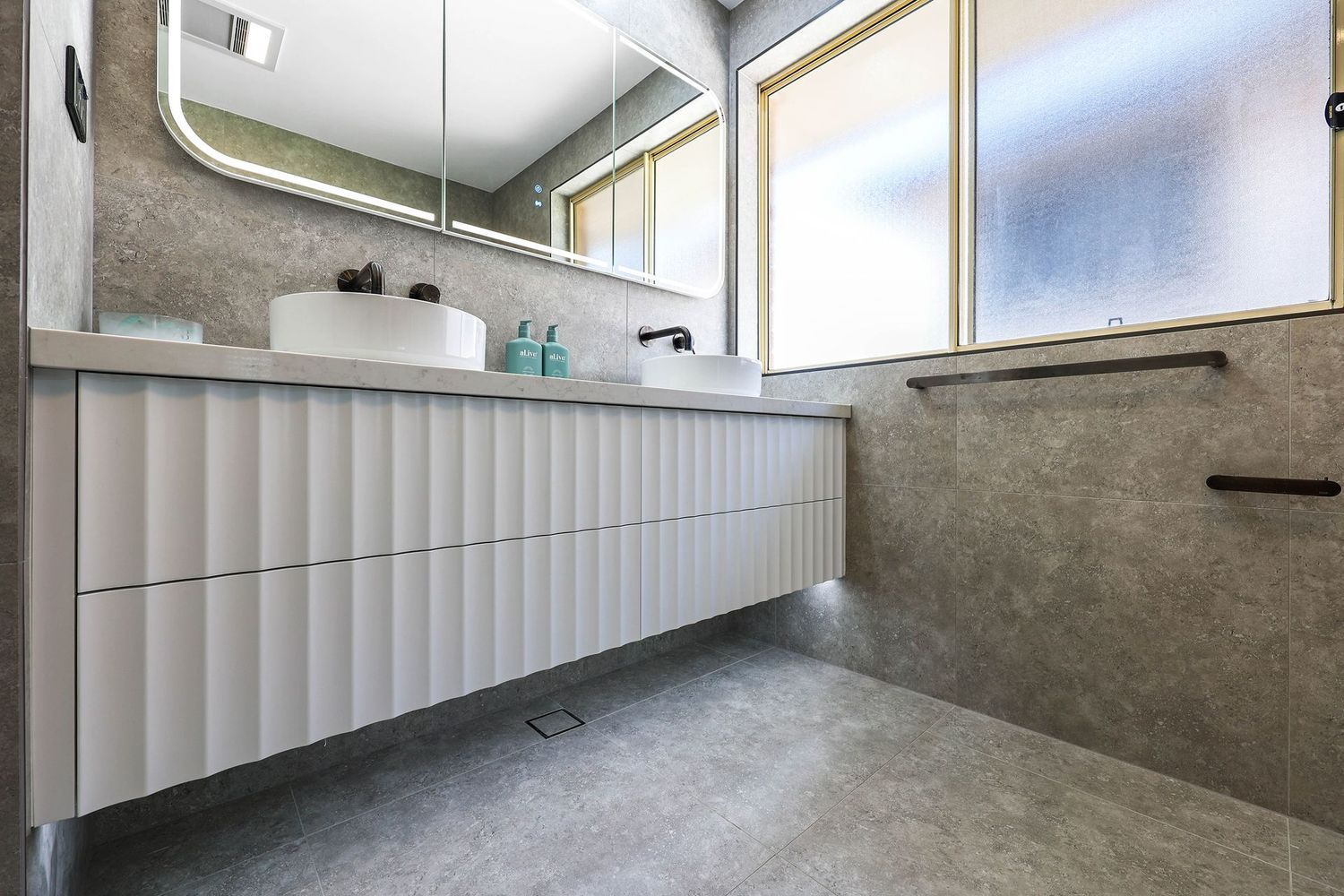 Modern Bathroom With Floating White Vanity — Above & Beyond Interiors in Smeaton Grange, NSW