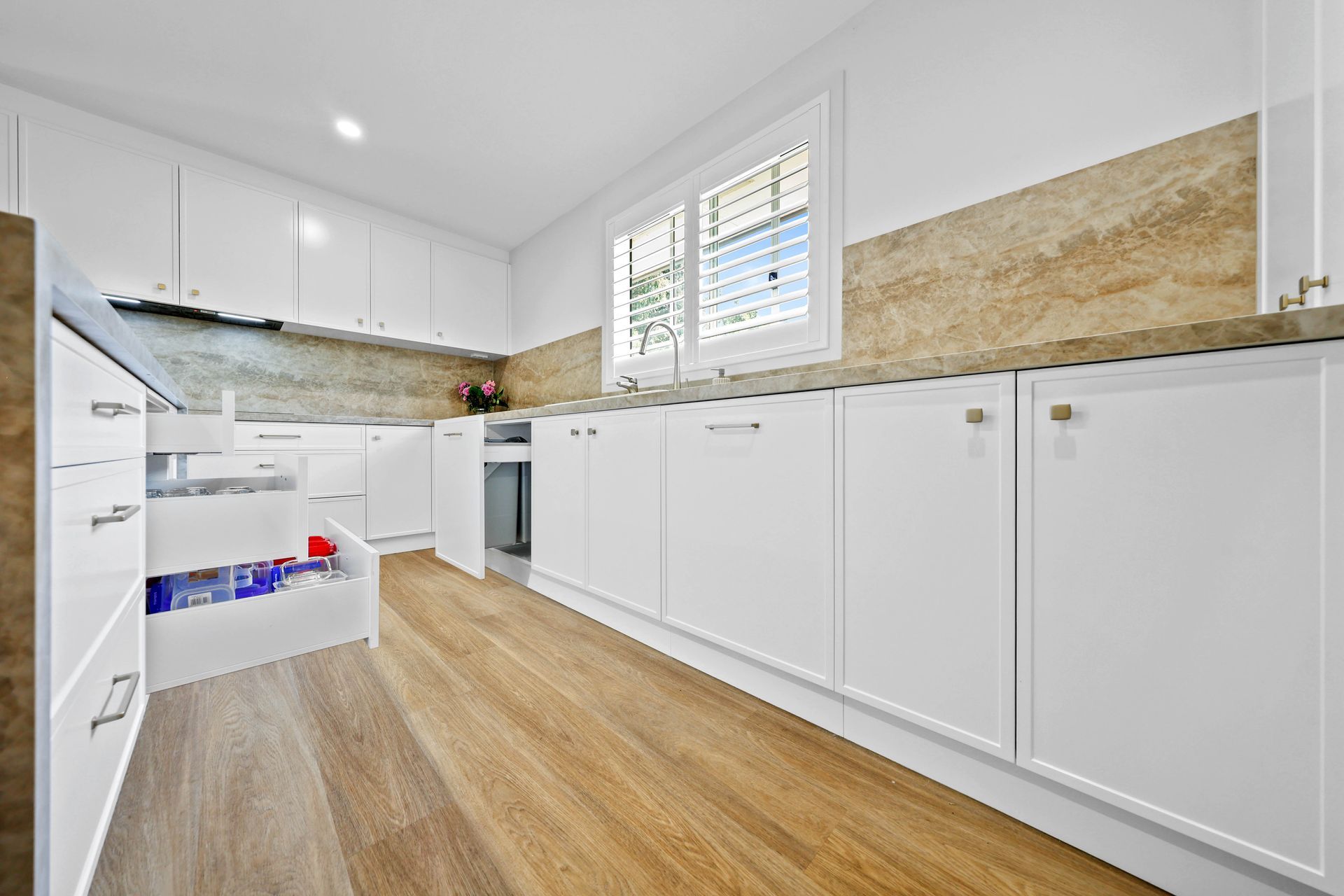 Bright Modern Kitchen With White Cabinets — Above & Beyond Interiors in Smeaton Grange, NSW