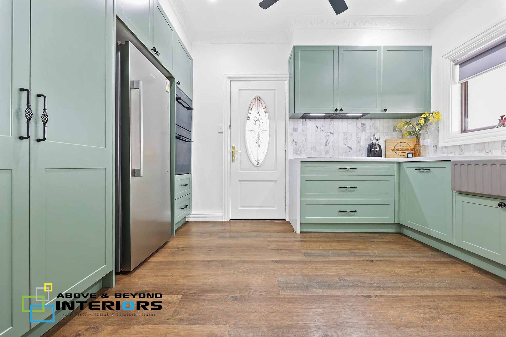 Bright Kitchen with Mint Cabinets — Above & Beyond Interiors in Smeaton Grange, NSW