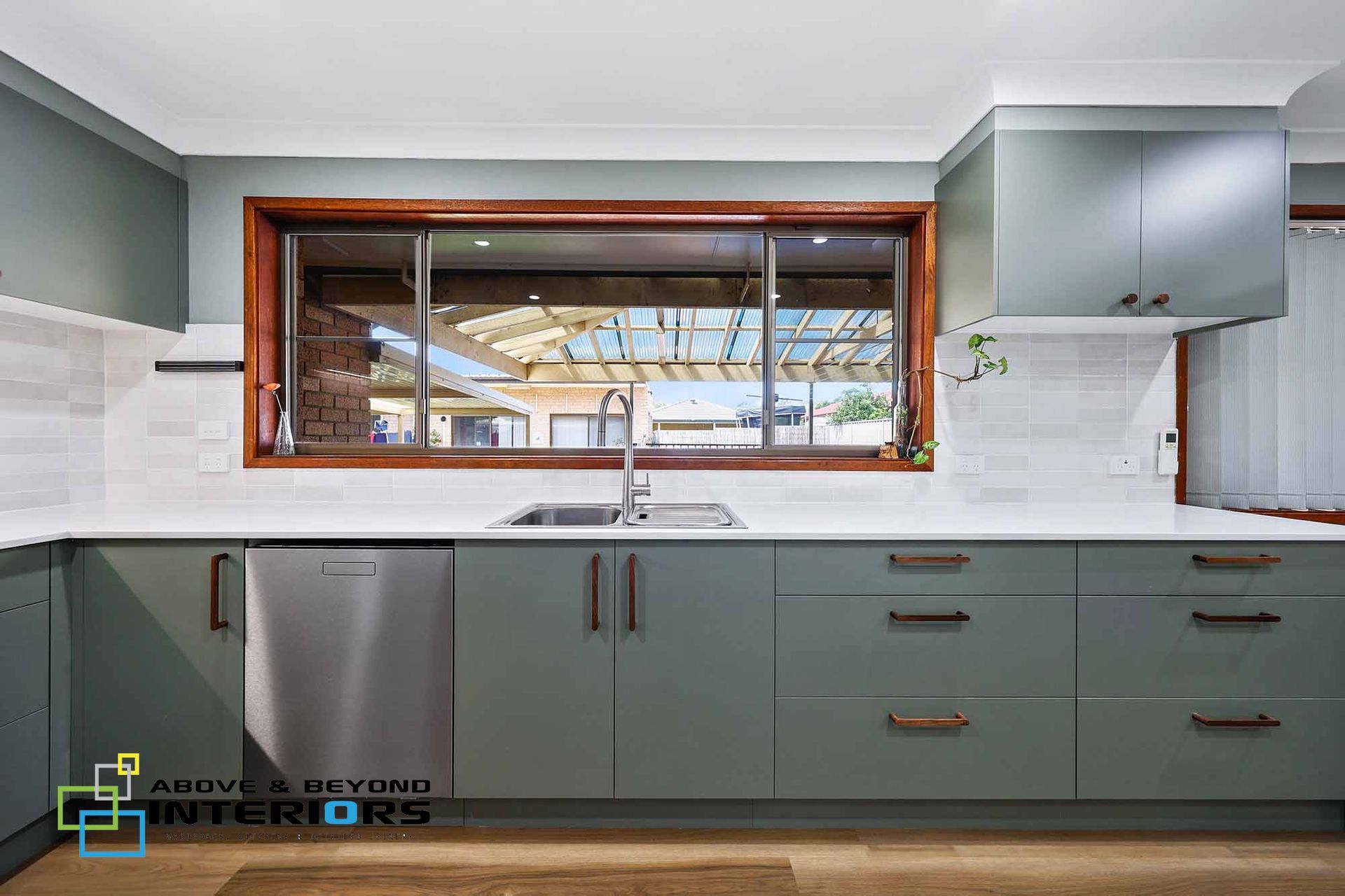 Modern Kitchen with Sage Green Cabinets — Above & Beyond Interiors in Smeaton Grange, NSW