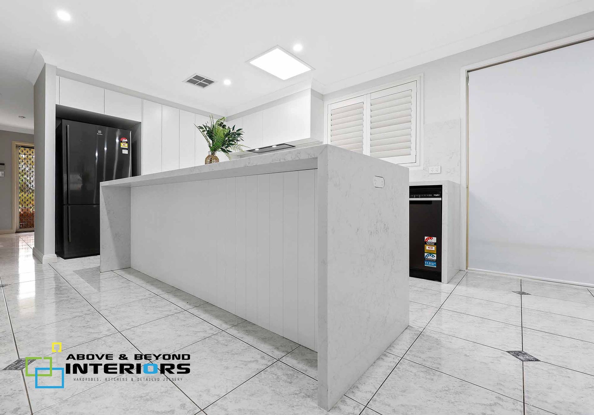 Bright White Modern Kitchen with An Island — Above & Beyond Interiors in Smeaton Grange, NSW