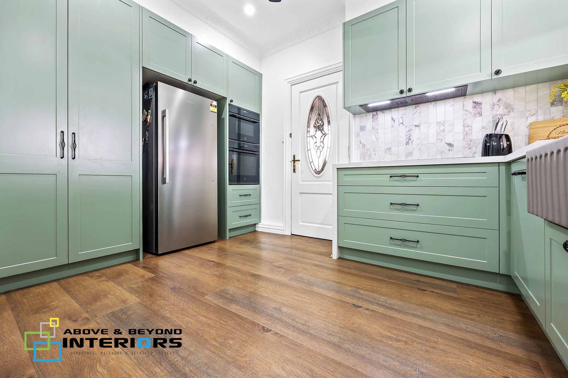 Mint-Green Kitchen with Stainless Steel Appliances — Above & Beyond Interiors in Smeaton Grange, NSW
