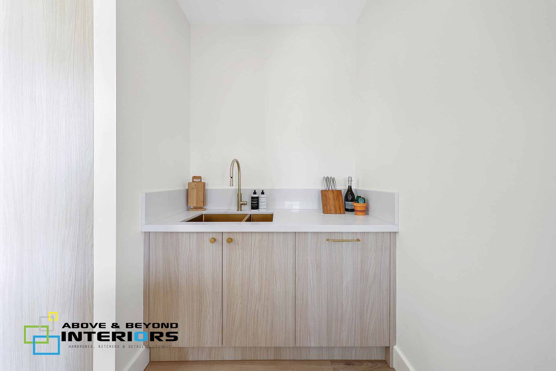 Minimalist Kitchen Nook with White Walls — Above & Beyond Interiors in Smeaton Grange, NSW