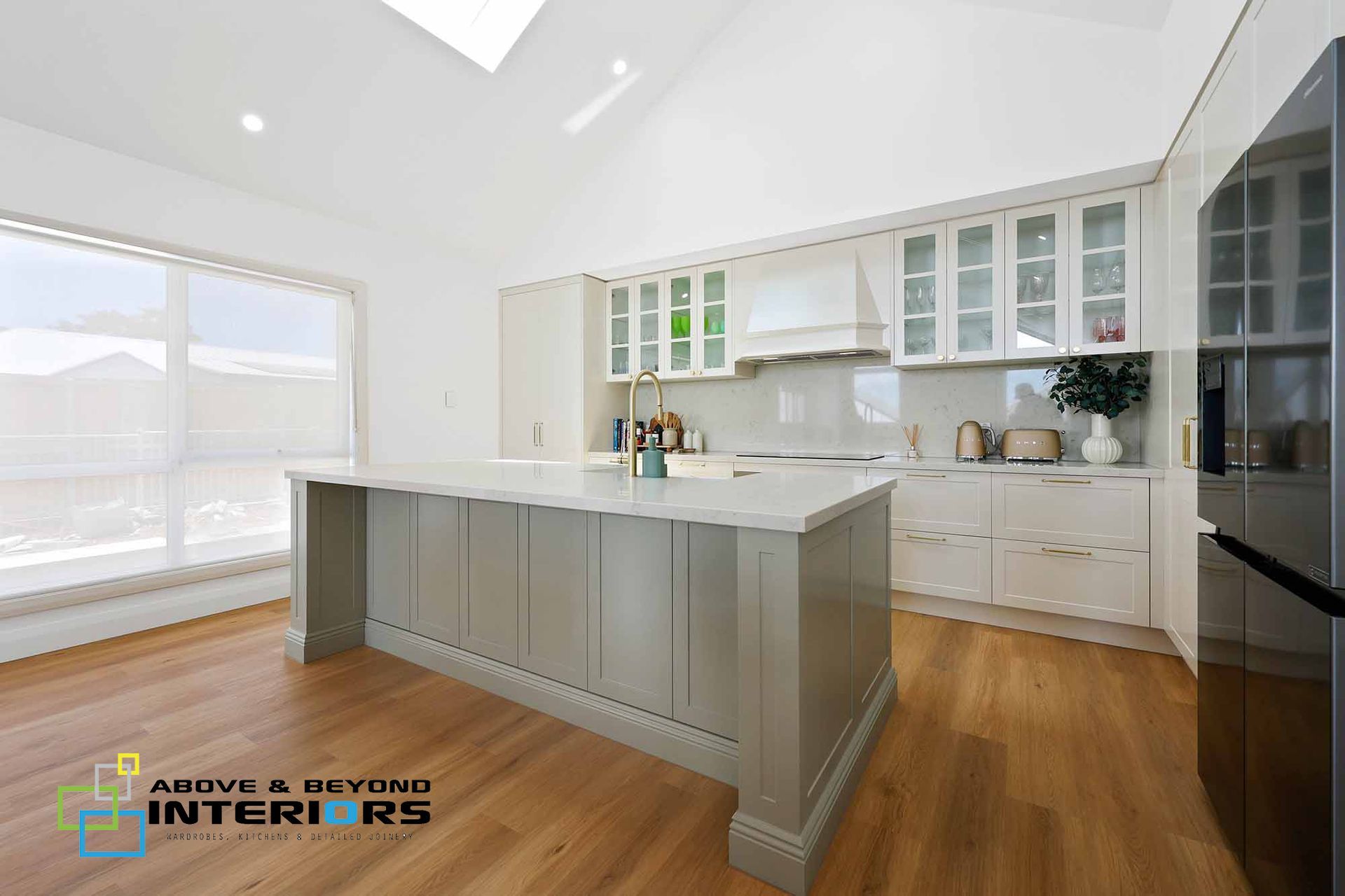 Bright Modern Kitchen with Cabinets, Wood Floors, and Large Windows — Above & Beyond Interiors in Smeaton Grange, NSW