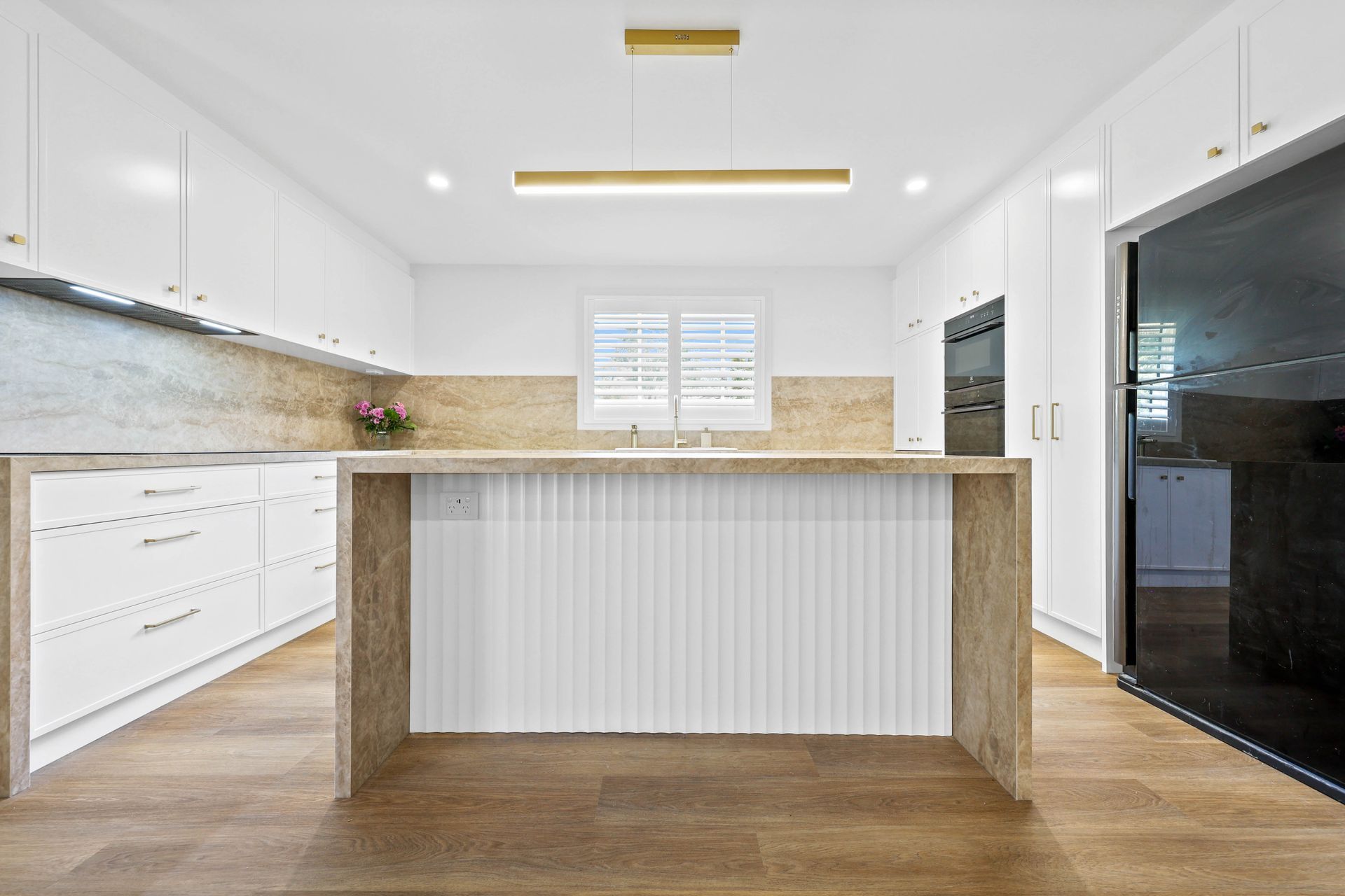 Bright Modern Kitchen With White Cabinets — Above & Beyond Interiors in Smeaton Grange, NSW