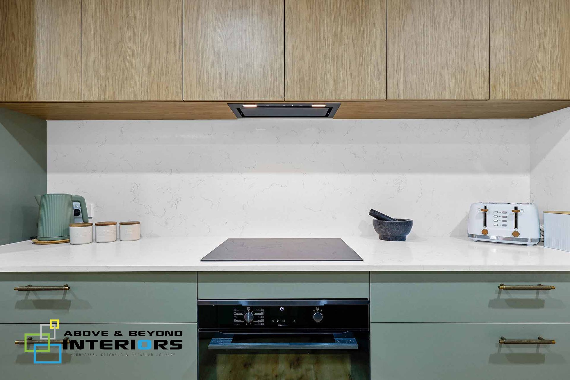 Modern Kitchen Countertop with Wood Cabinets — Above & Beyond Interiors in Smeaton Grange, NSW