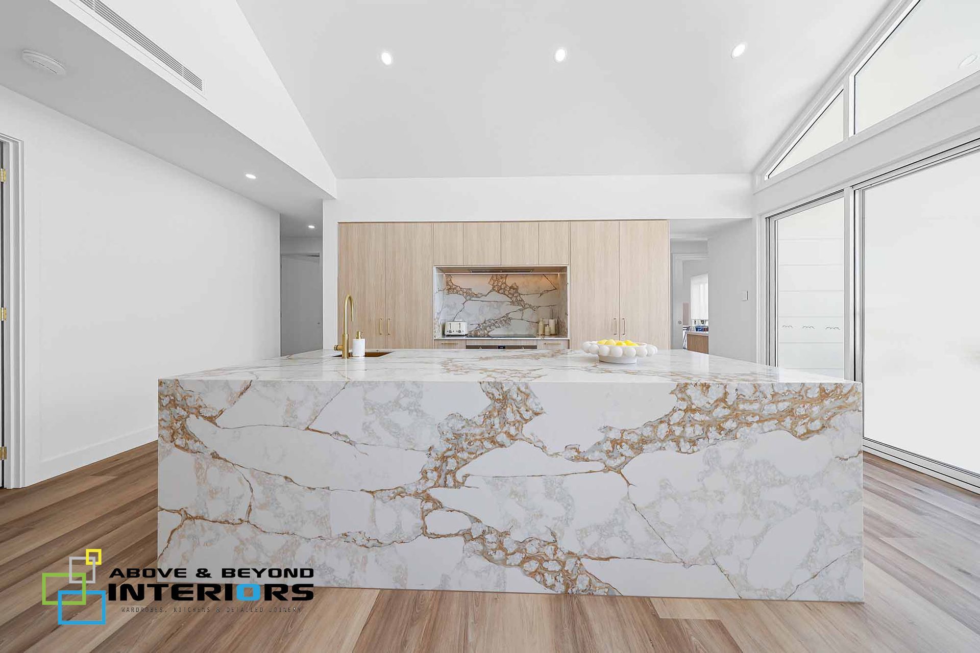 Modern Luxury Kitchen with A White Marble Island — Above & Beyond Interiors in Smeaton Grange, NSW