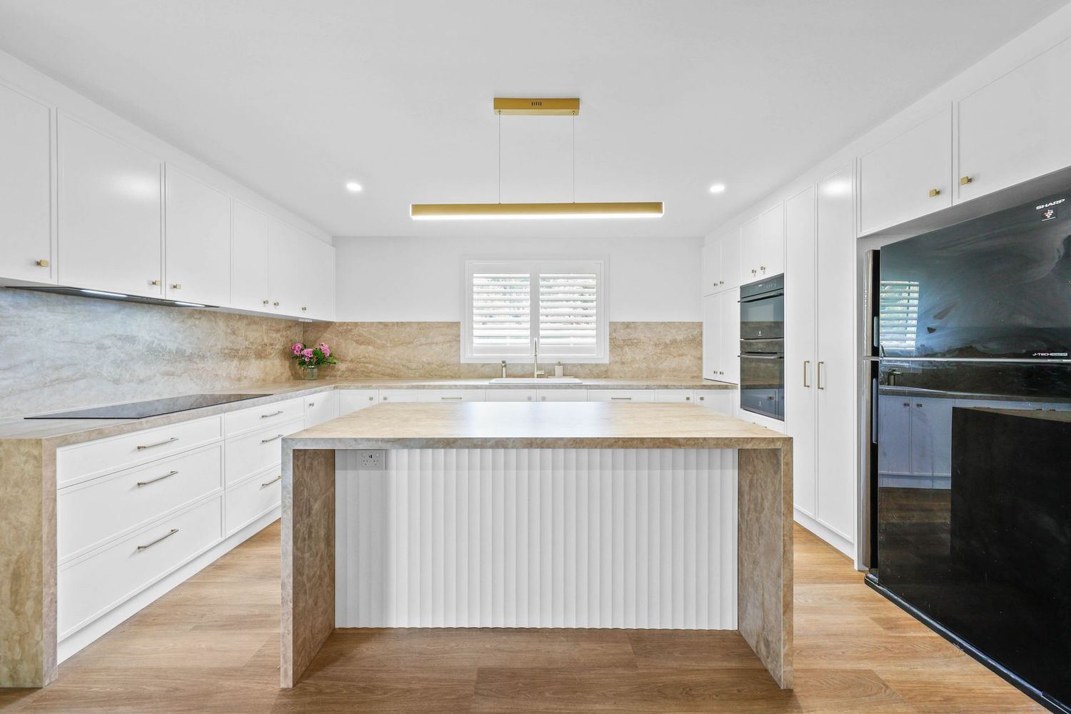 Bright Modern White Kitchen With Large Island — Above & Beyond Interiors in Smeaton Grange, NSW