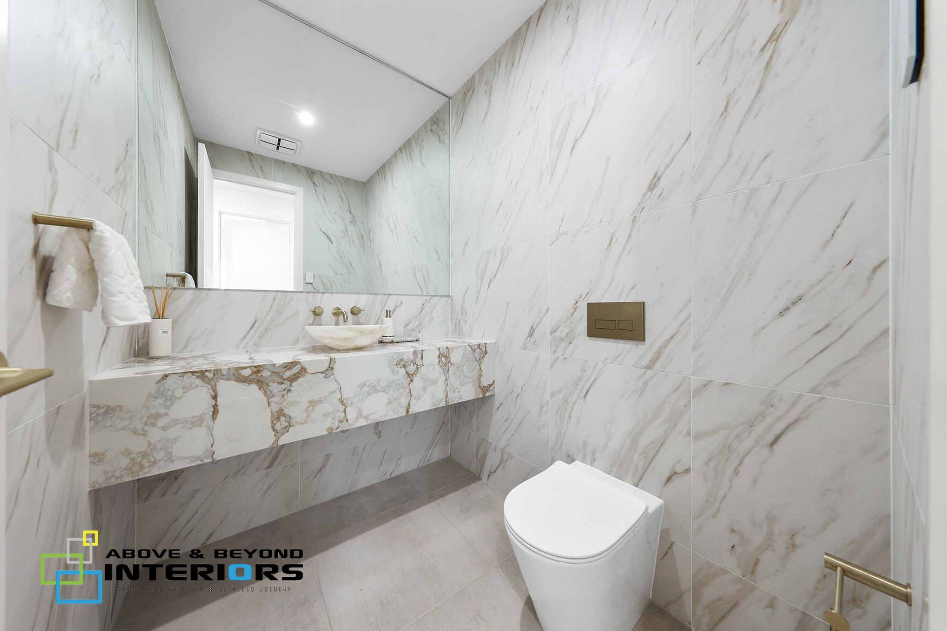 Modern Marble Bathroom with Floating Vanity — Above & Beyond Interiors in Smeaton Grange, NSW