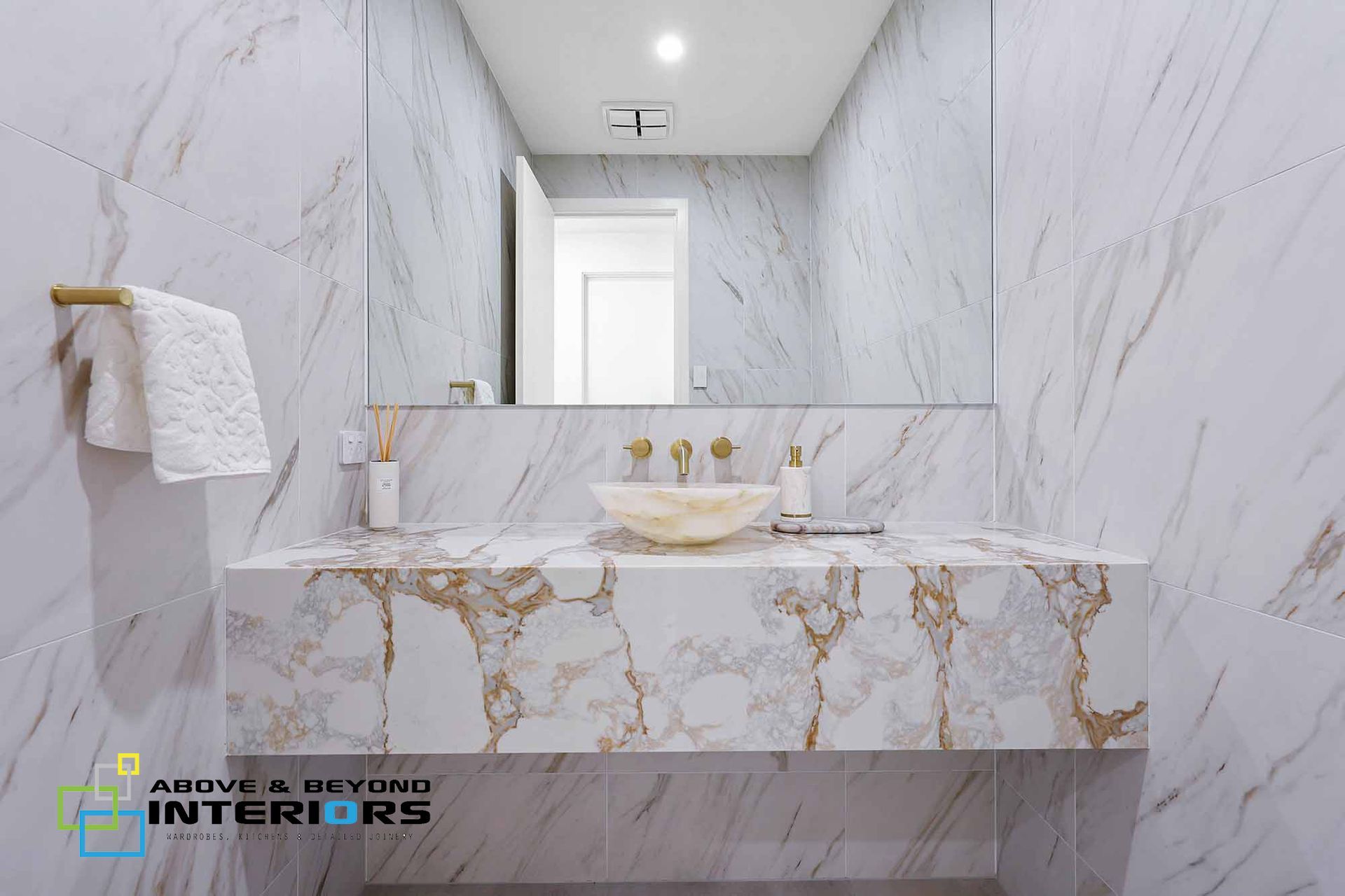 Modern Marble Bathroom with A Floating Vanity — Above & Beyond Interiors in Smeaton Grange, NSW