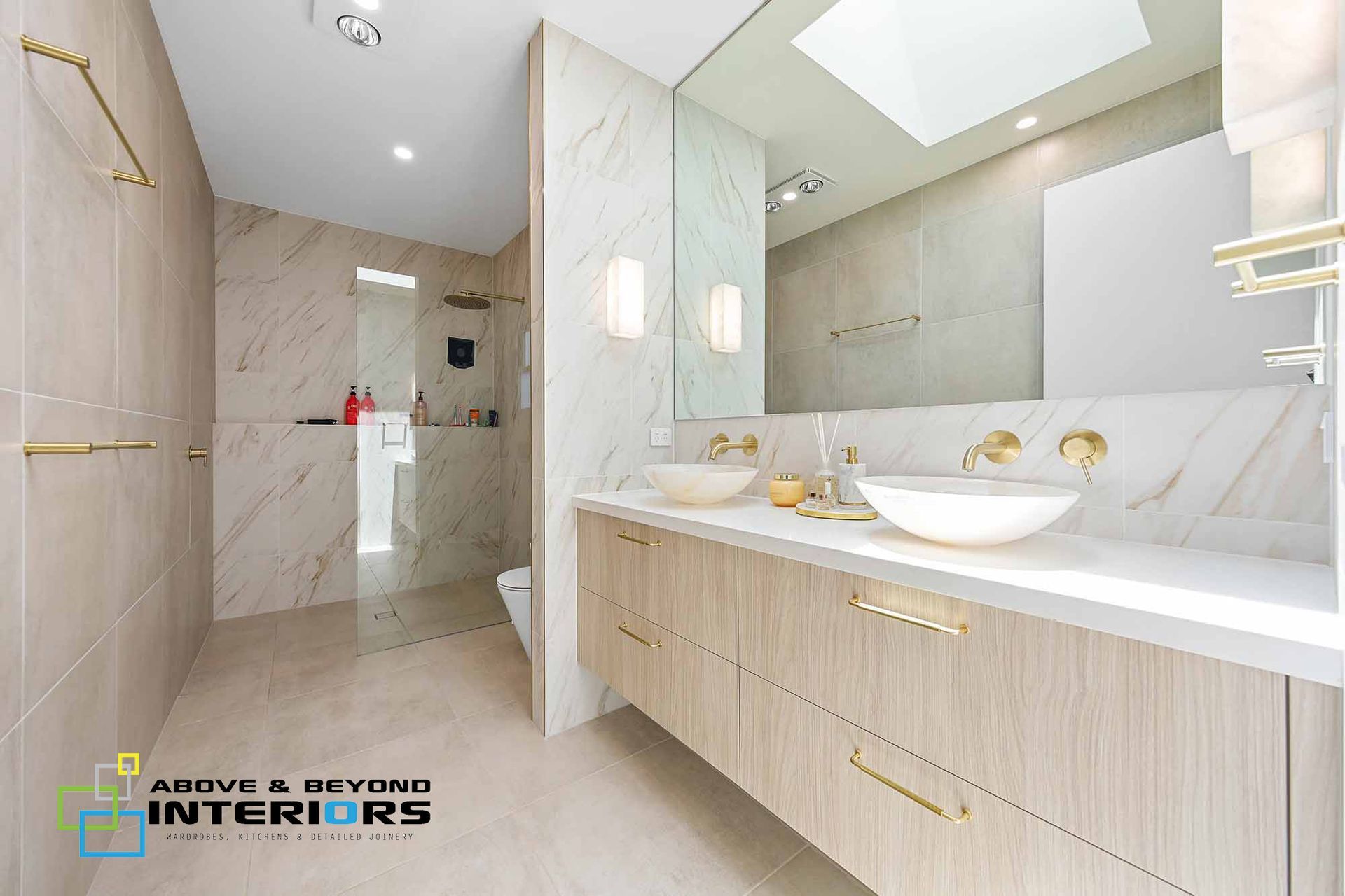 Bright Modern Bathroom with Marble Shower — Above & Beyond Interiors in Smeaton Grange, NSW
