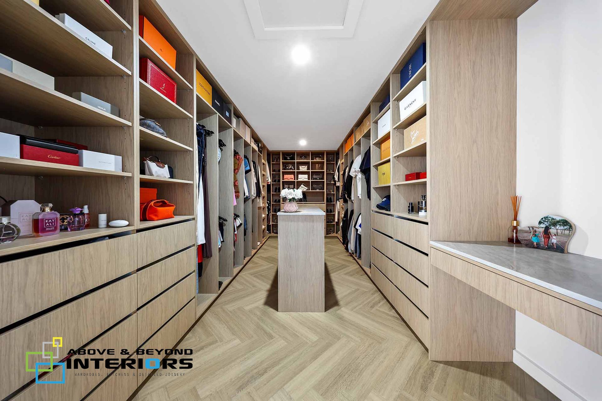 Modern Walk-In Closet with Wood Shelving — Above & Beyond Interiors in Smeaton Grange, NSW