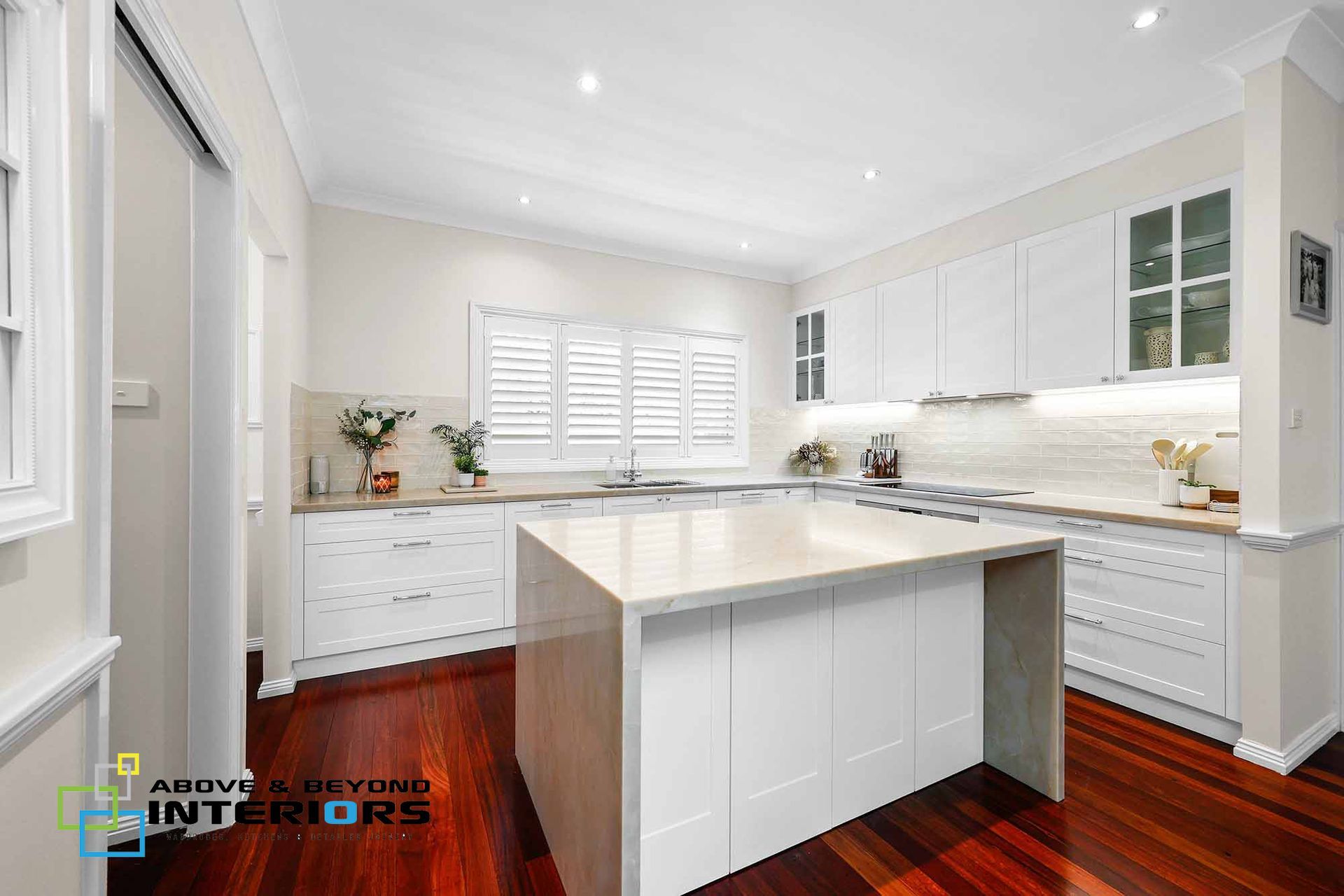 Bright Modern White Kitchen with Island — Above & Beyond Interiors in Smeaton Grange, NSW