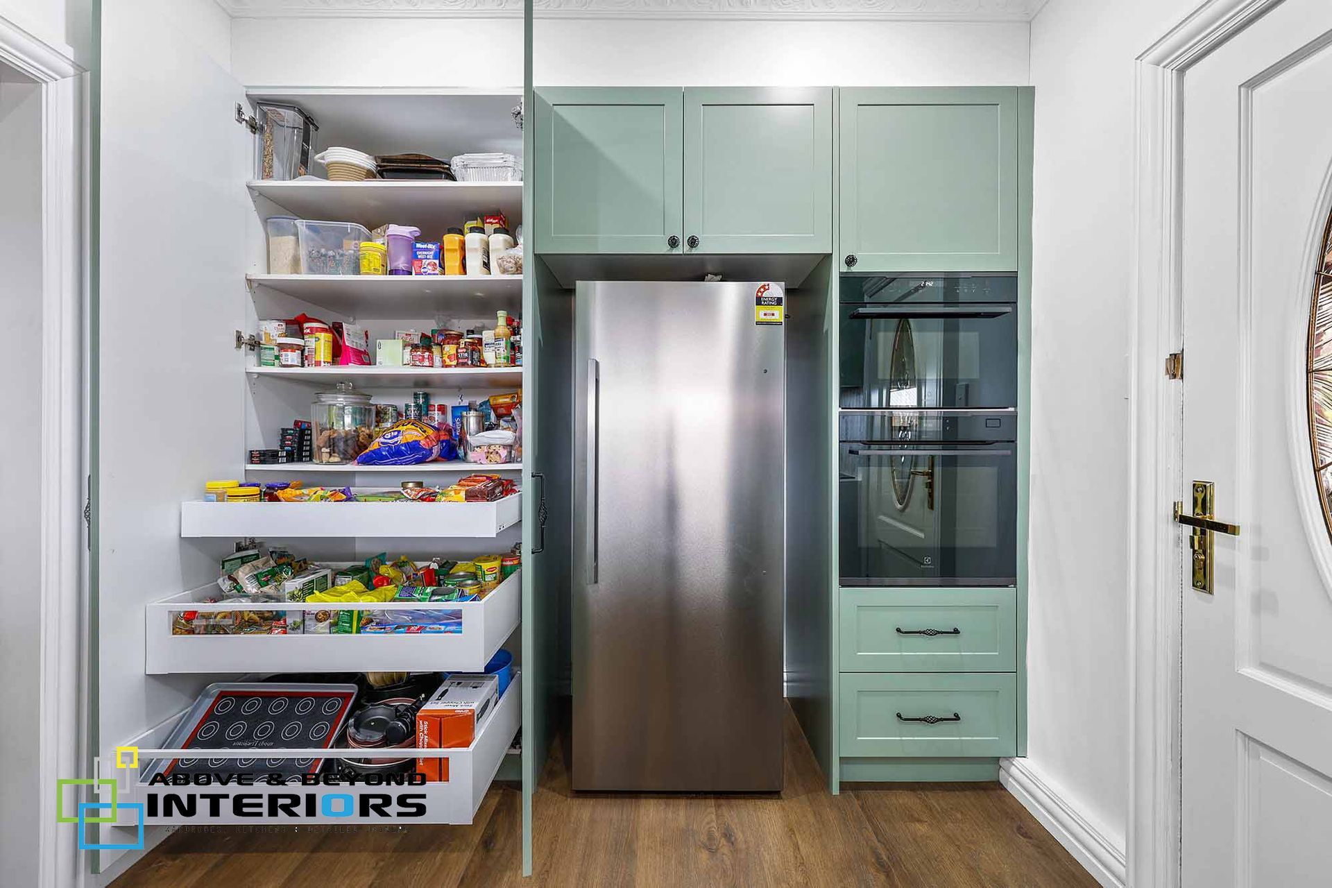 Compact Pantry and Refrigerator Nook with Open Shelving — Above & Beyond Interiors in Smeaton Grange, NSW