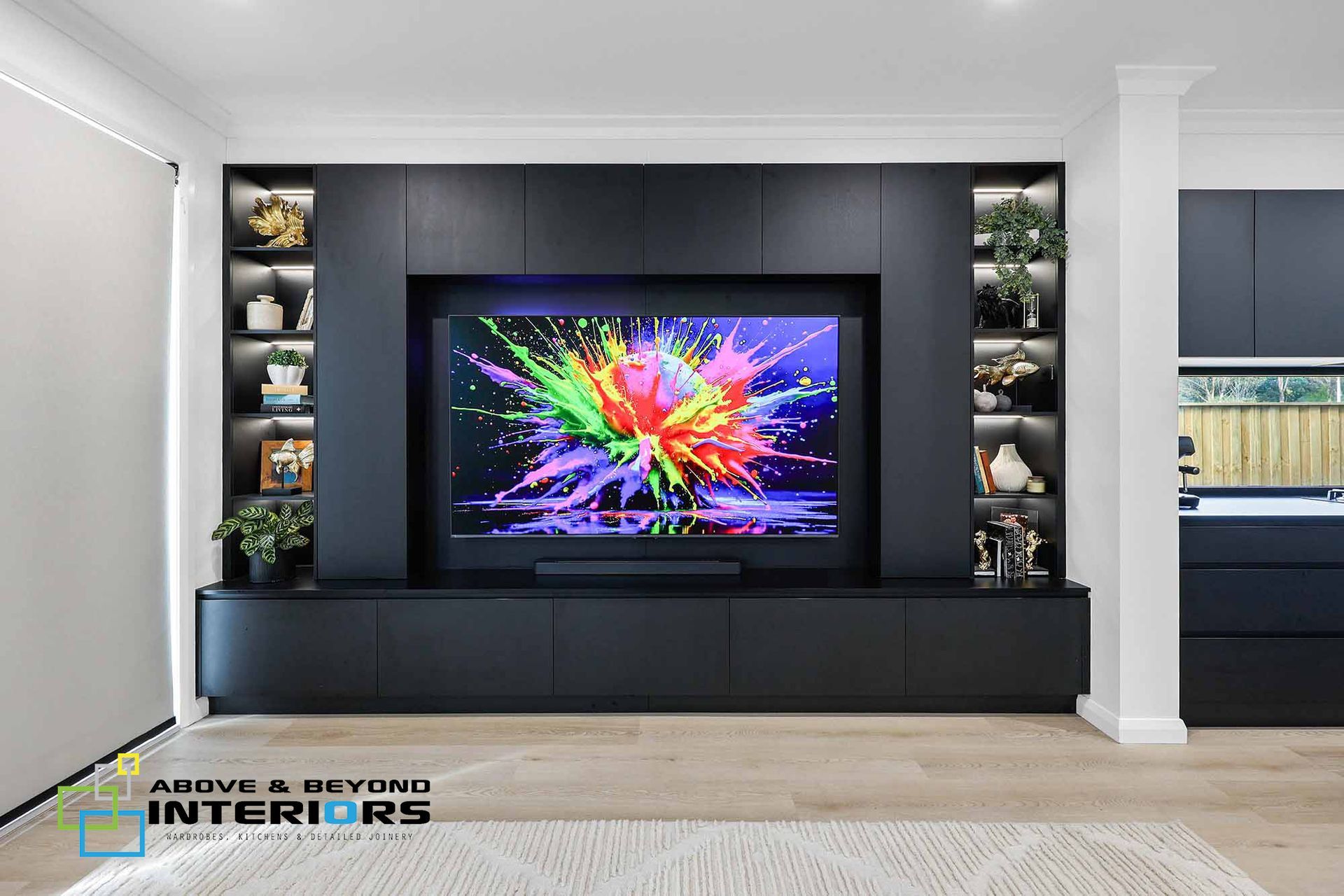 A Living Room with A Built-In Black Media Wall — Above & Beyond Interiors in Smeaton Grange, NSW