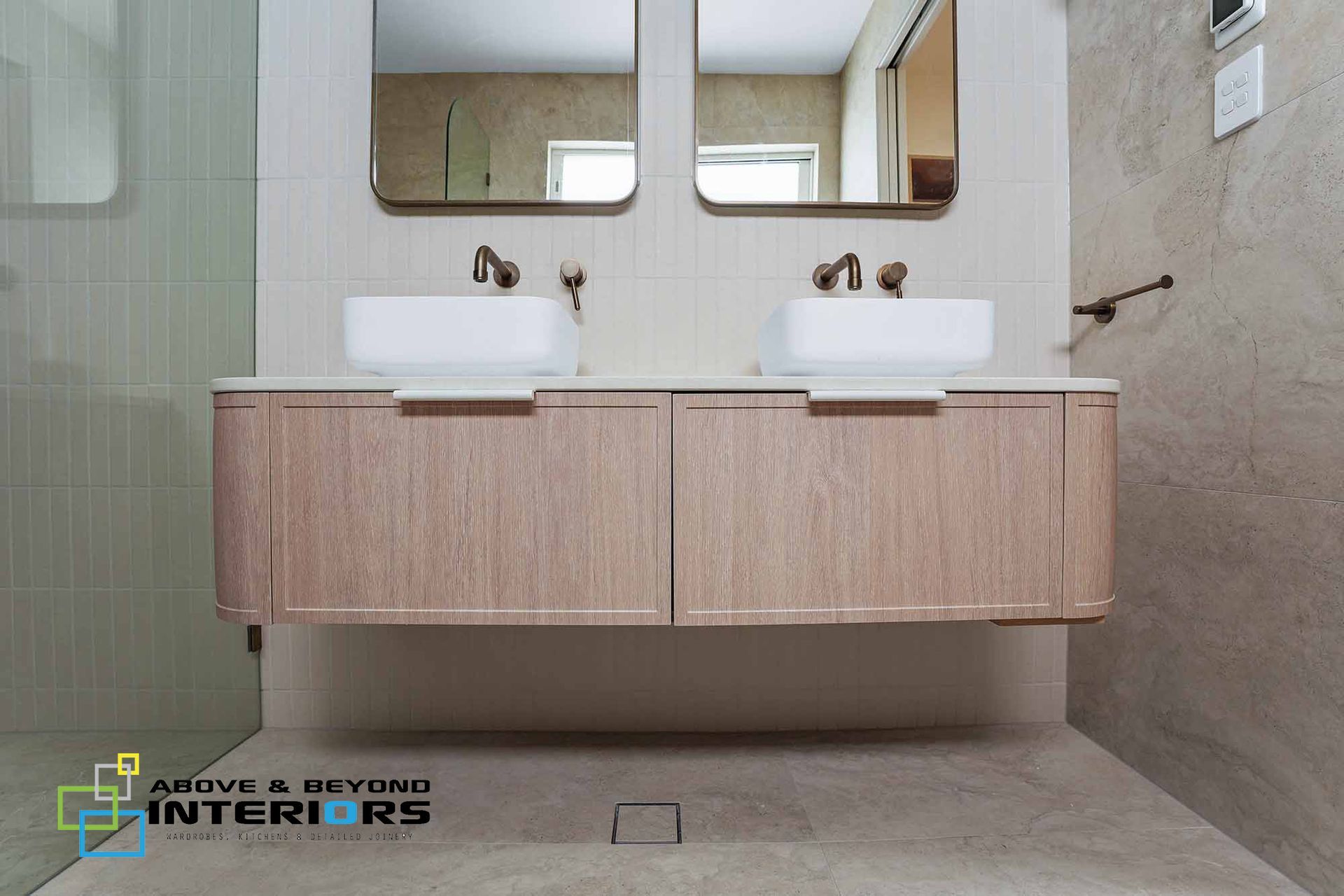 Modern Bathroom with Double Sinks, Wood Vanity, and Large Mirrors — Above & Beyond Interiors in Smeaton Grange, NSW
