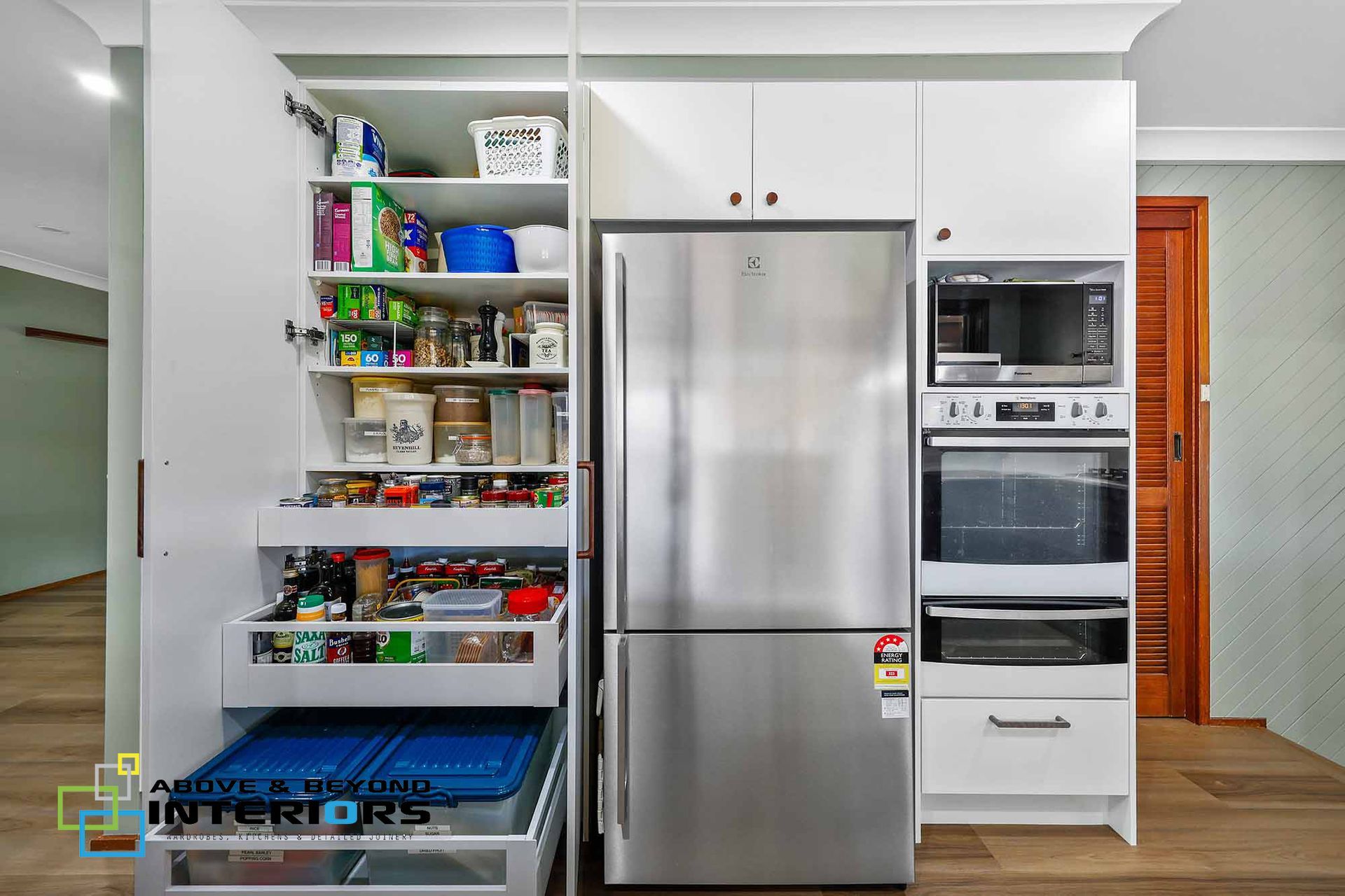 Open Pantry and Kitchen with Organized Shelves — Above & Beyond Interiors in Smeaton Grange, NSW