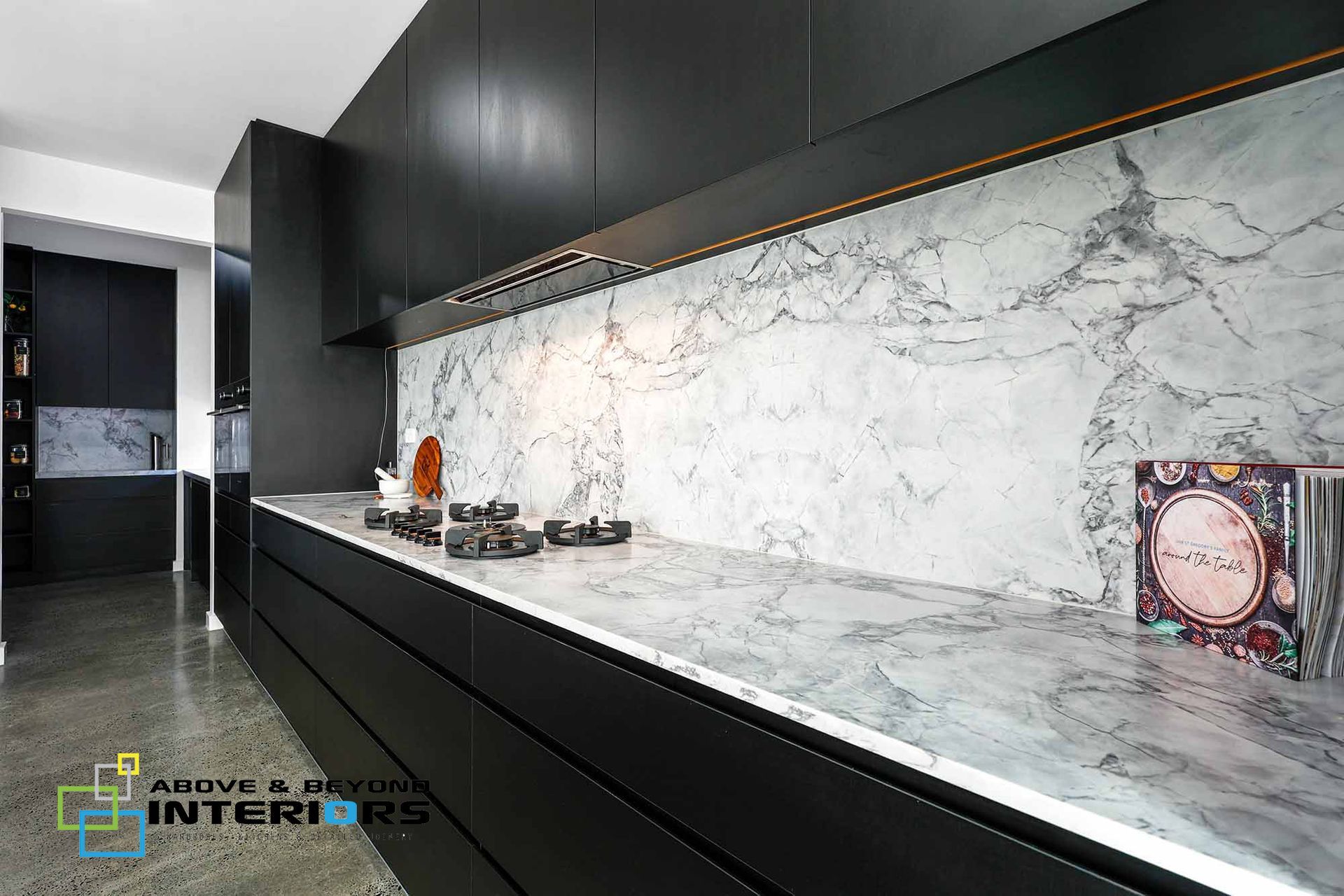 Modern Black Kitchen with Marble Backsplash — Above & Beyond Interiors in Smeaton Grange, NSW