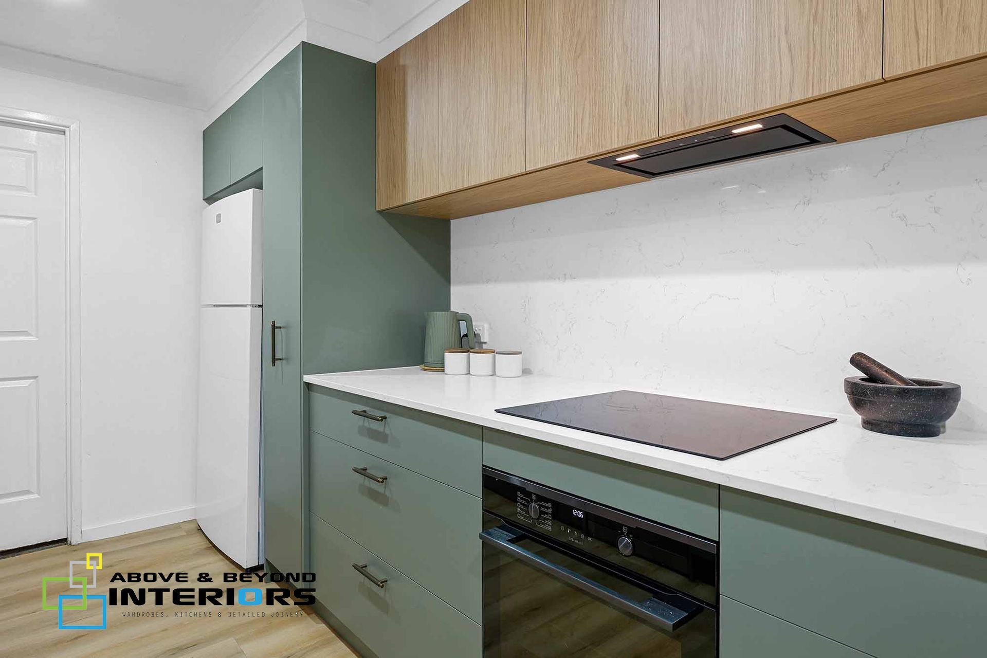 Modern Kitchen with Green Cabinets — Above & Beyond Interiors in Smeaton Grange, NSW