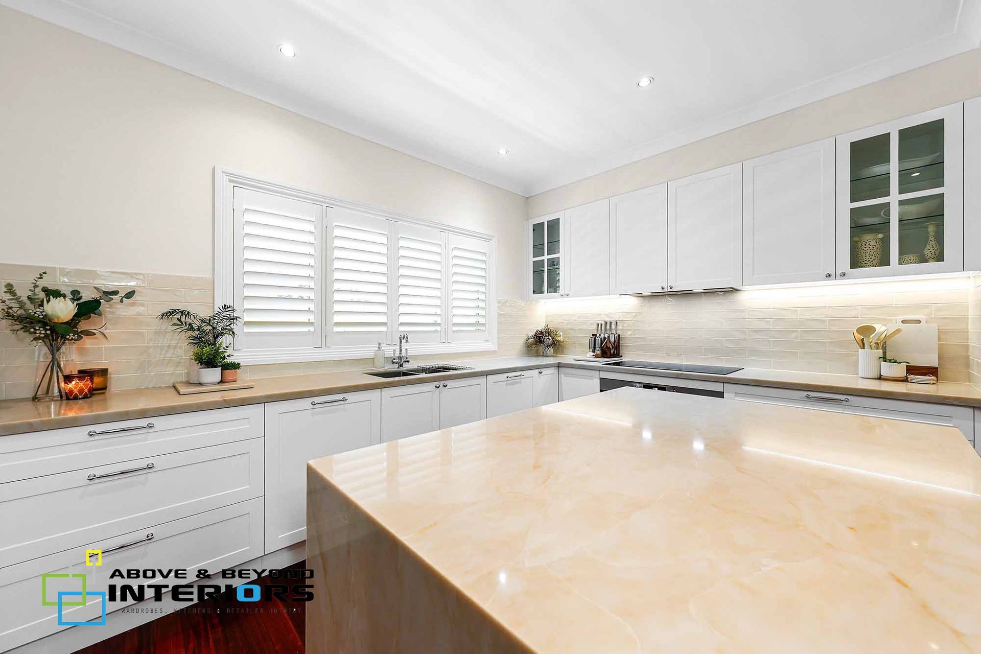Bright Modern Kitchen with White Cabinets — Above & Beyond Interiors in Smeaton Grange, NSW