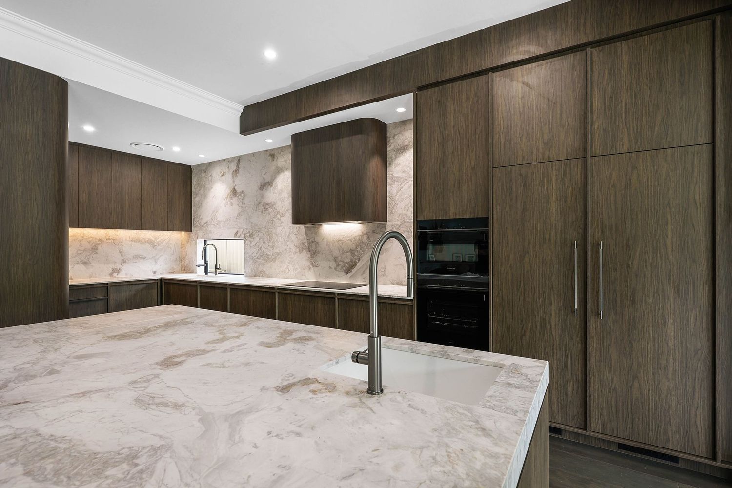 Modern Kitchen With Large Marble Island — Above & Beyond Interiors in Smeaton Grange, NSW