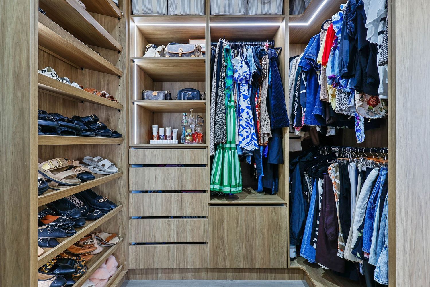 Walk-in Closet With Shelves, Drawers, and Hanging Clothes in Blue — Above & Beyond Interiors in Smeaton Grange, NSW
