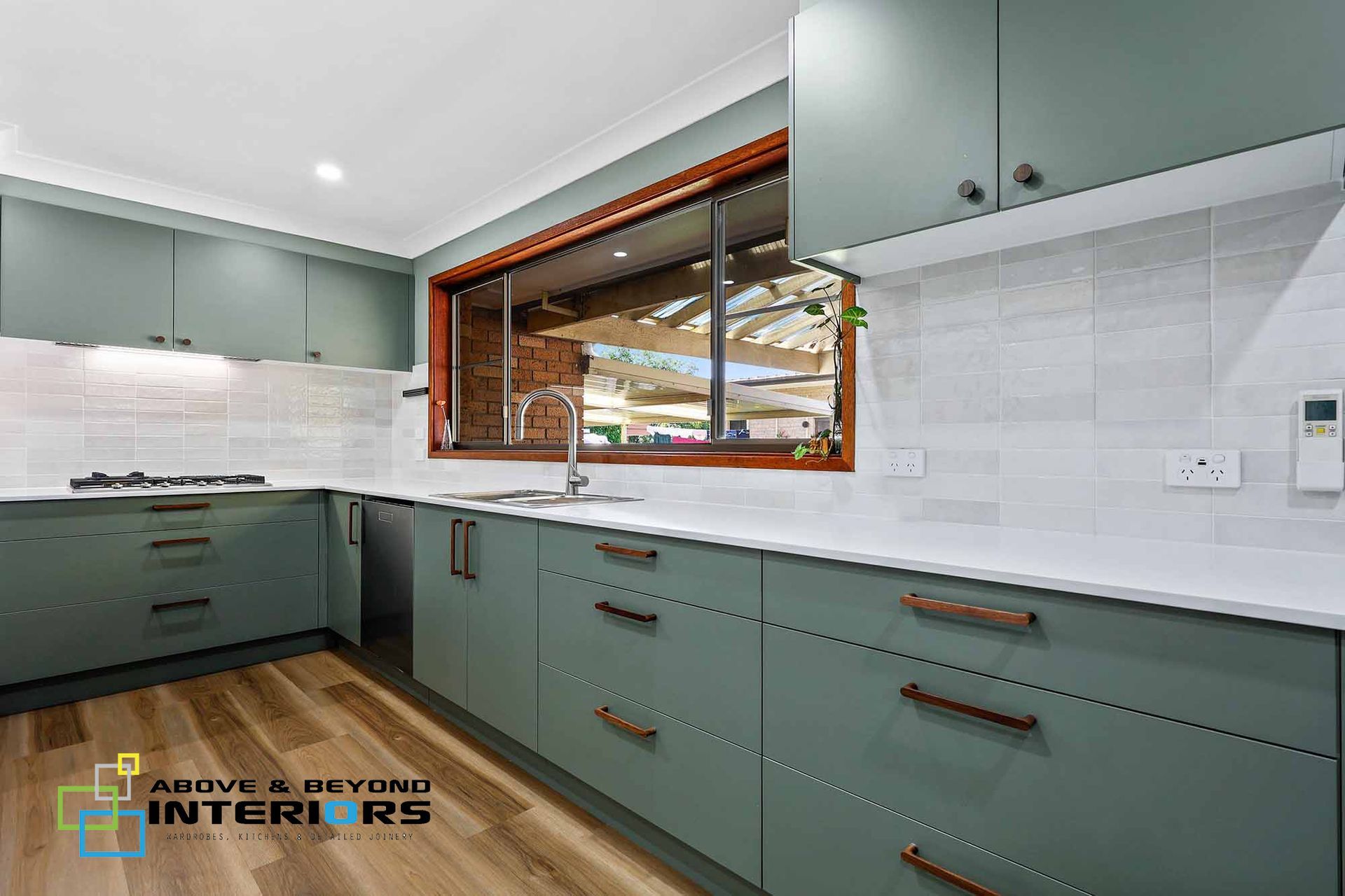 Modern Kitchen with Sage Green Cabinets, and White Tile Backsplash — Above & Beyond Interiors in Smeaton Grange, NSW
