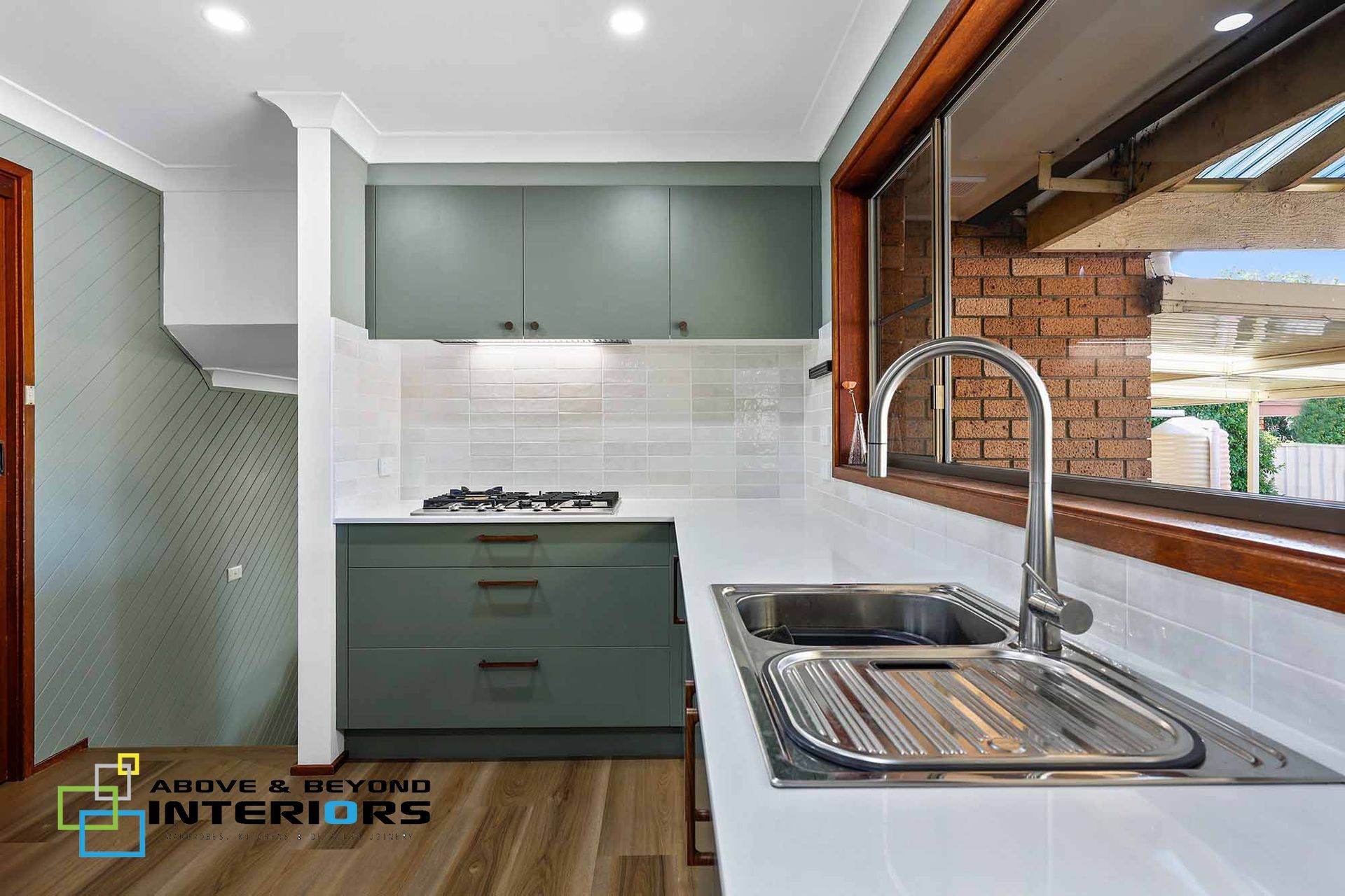 Modern Kitchen with Green Cabinets, and White Backsplash — Above & Beyond Interiors in Smeaton Grange, NSW