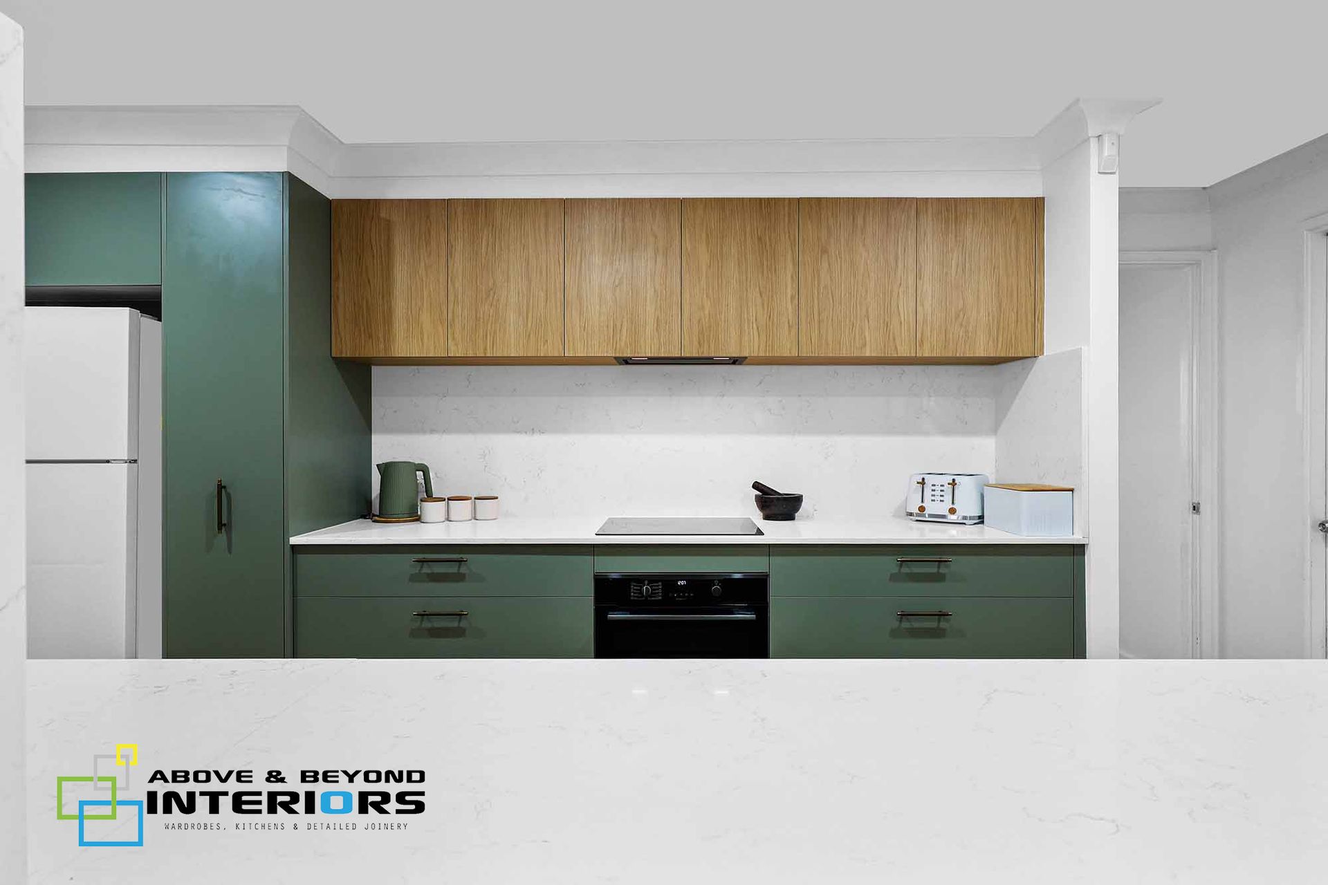 Modern Kitchen with Countertops, and Wood Upper Cabinets — Above & Beyond Interiors in Smeaton Grange, NSW
