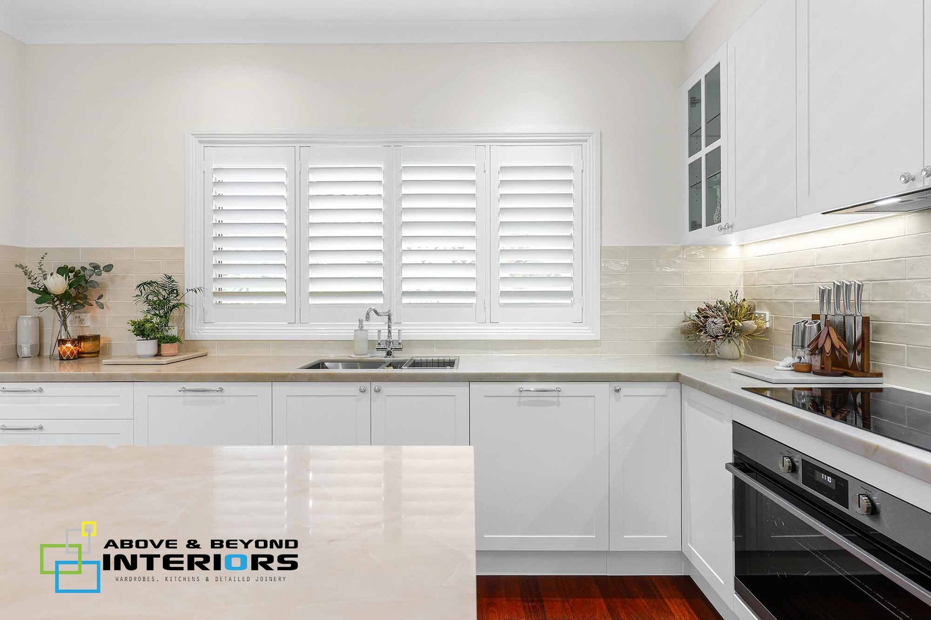 A Modern Kitchen with Stainless Appliances — Above & Beyond Interiors in Smeaton Grange, NSW