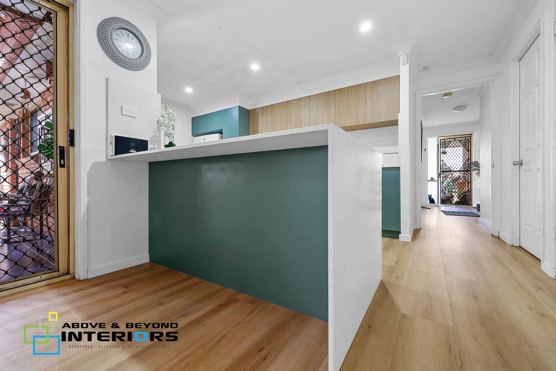 Modern Kitchen with A Teal Island, and Light Wood Floors — Above & Beyond Interiors in Smeaton Grange, NSW