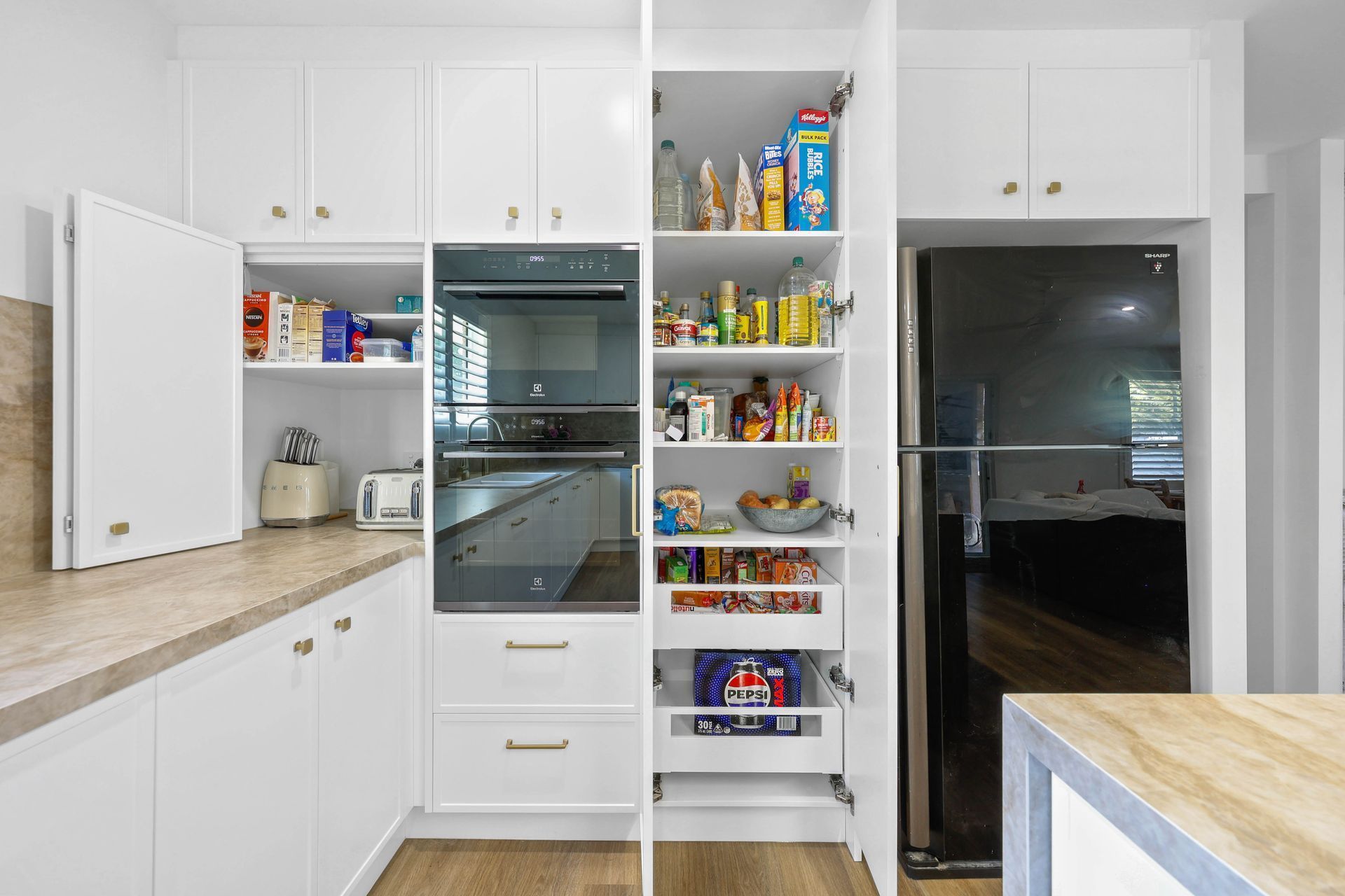 Modern White Kitchen With Open Pantry — Above & Beyond Interiors in Smeaton Grange, NSW