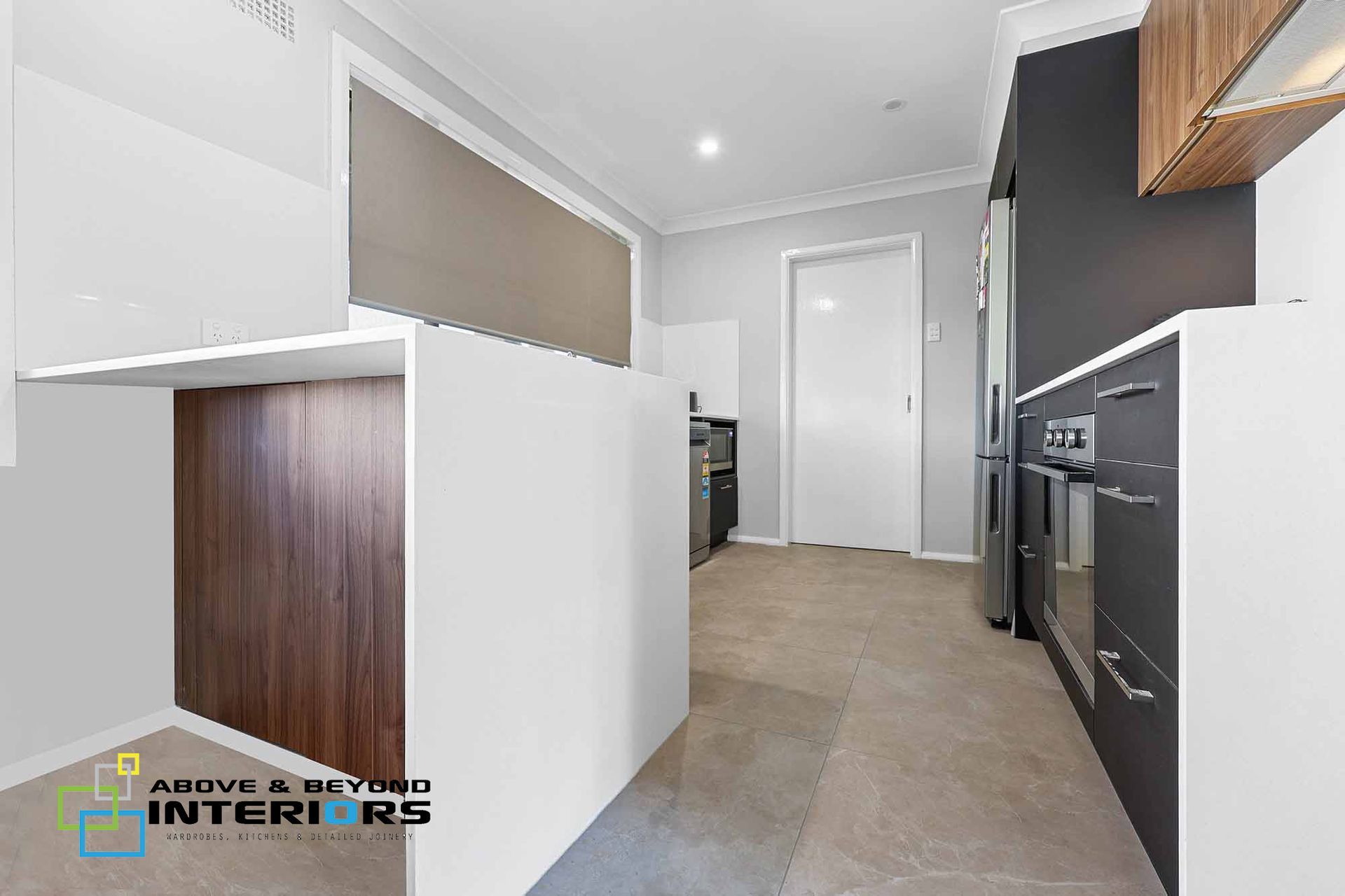 Modern Kitchen with White and Dark Cabinetry — Above & Beyond Interiors in Smeaton Grange, NSW
