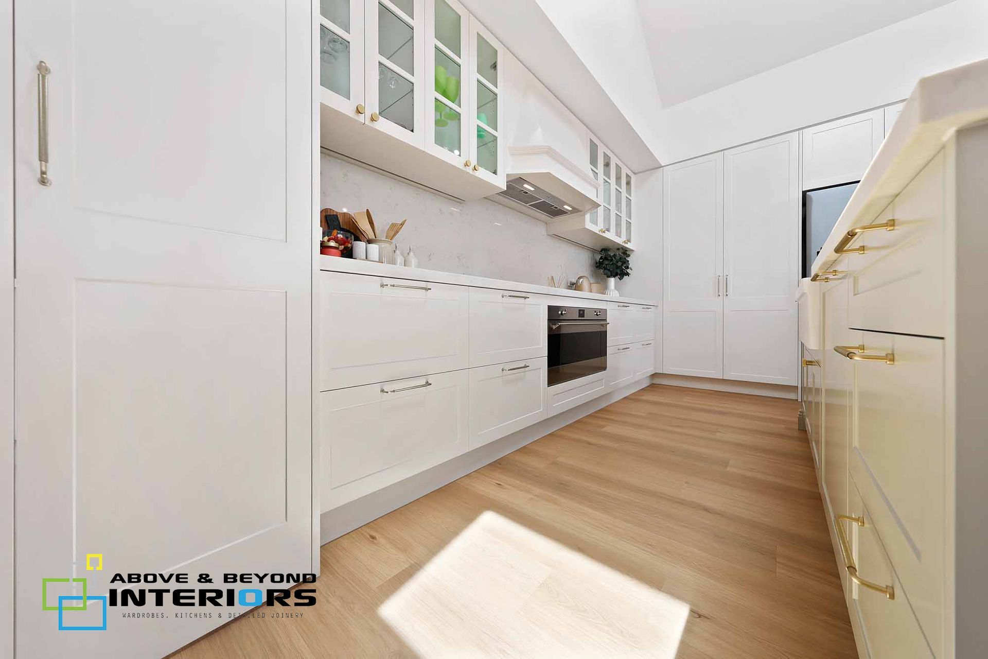 Bright Modern Kitchen with White Cabinets — Above & Beyond Interiors in Smeaton Grange, NSW