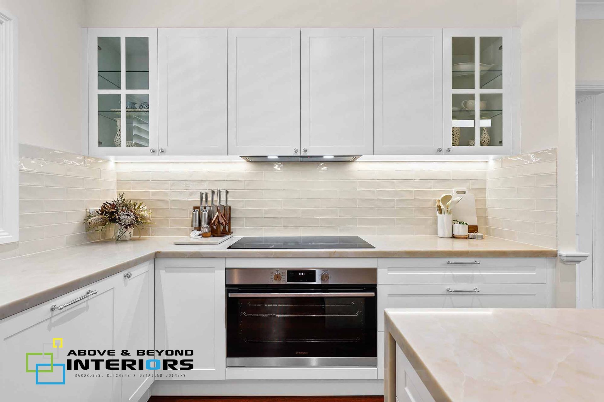 Bright White Modern Kitchen with Cabinets, Island, and Subway Tile Backsplash — Above & Beyond Interiors in Smeaton Grange, NSW