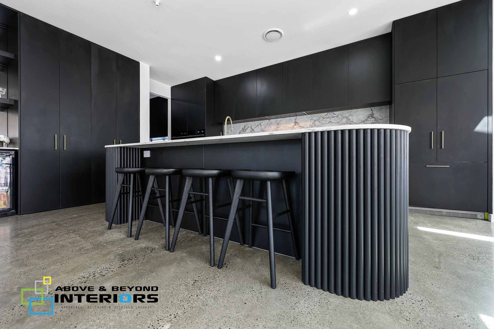 Modern Black Kitchen with Island — Above & Beyond Interiors in Smeaton Grange, NSW