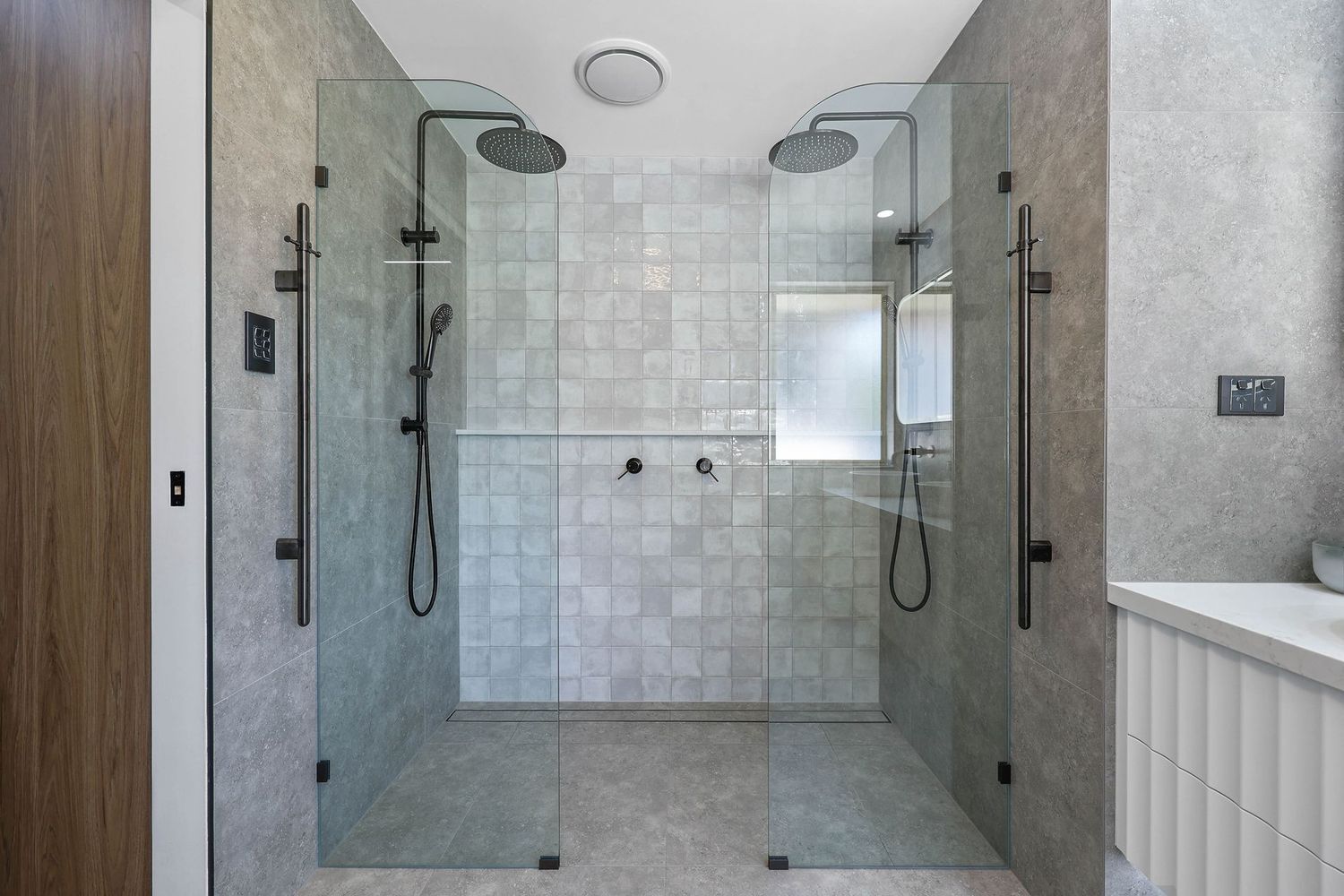 Modern Bathroom With a Glass-enclosed Walk-in Shower — Above & Beyond Interiors in Smeaton Grange, NSW