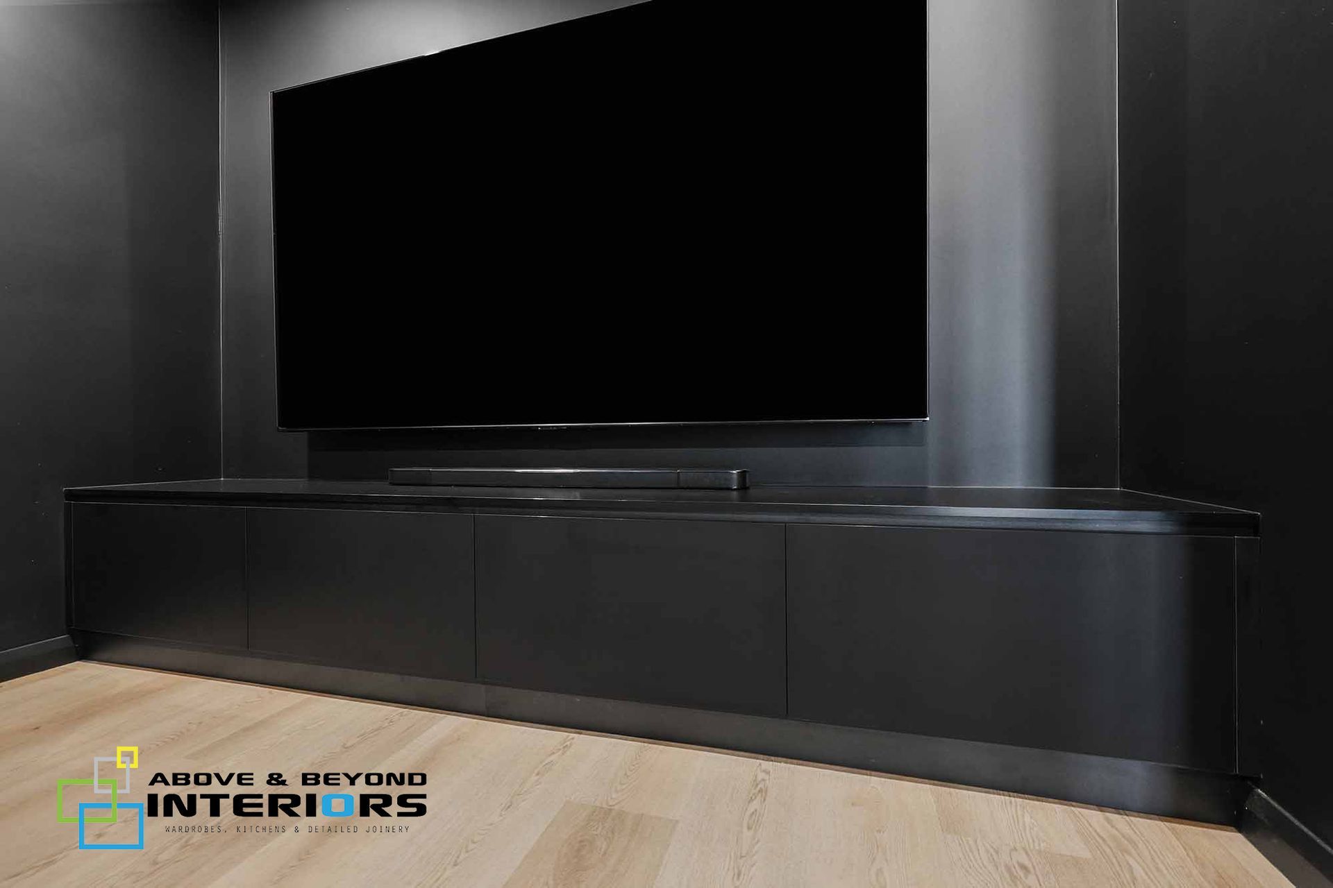 A Living Room with A Wall-Mounted Tv — Above & Beyond Interiors in Smeaton Grange, NSW