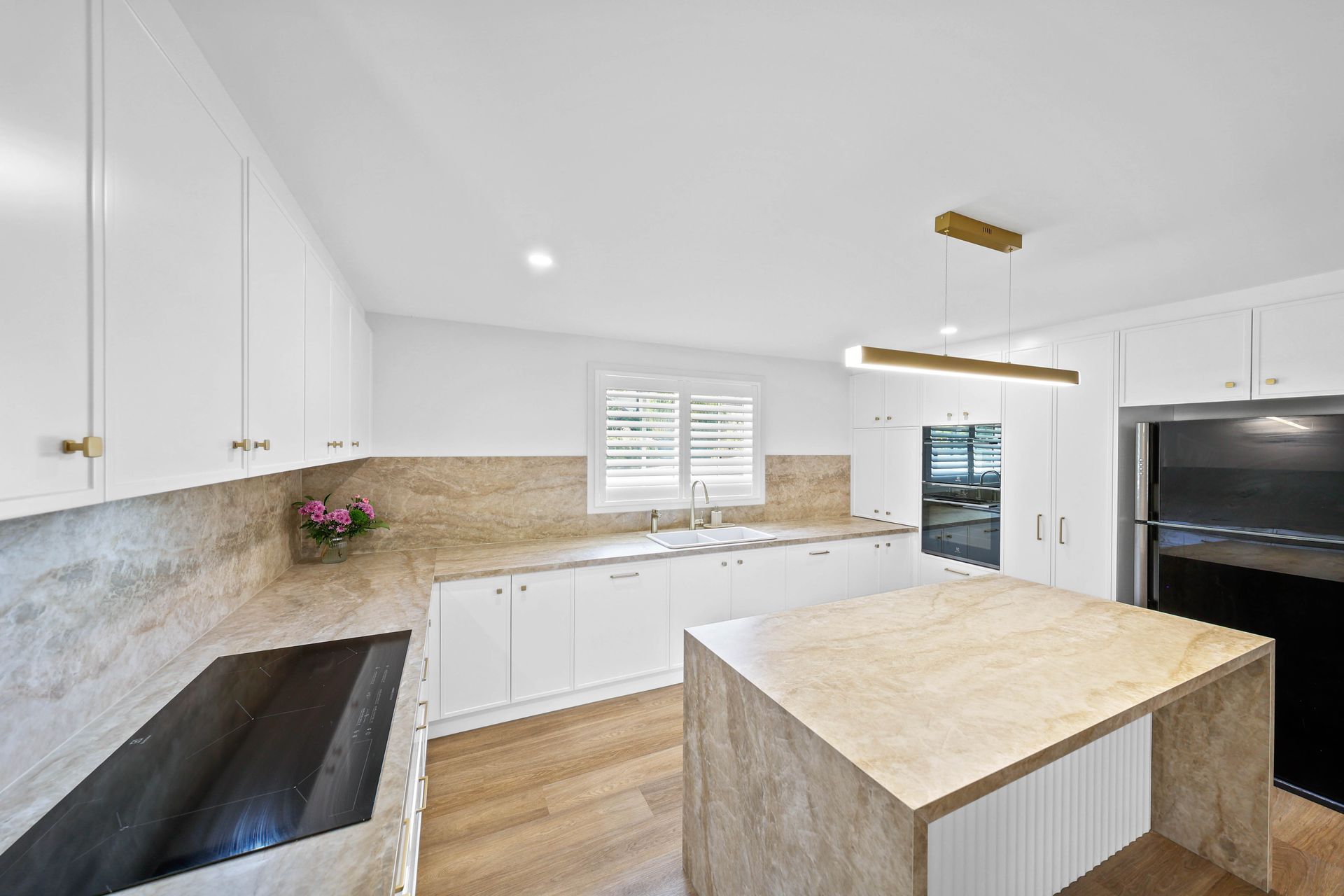 Bright Modern Kitchen With White Cabinets — Above & Beyond Interiors in Smeaton Grange, NSW