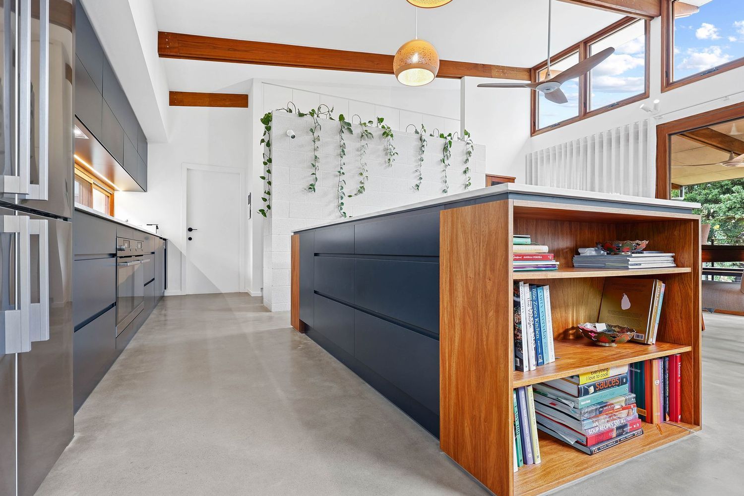 Modern Kitchen With Concrete Floor, Dark Island — Above & Beyond Interiors in Smeaton Grange, NSW