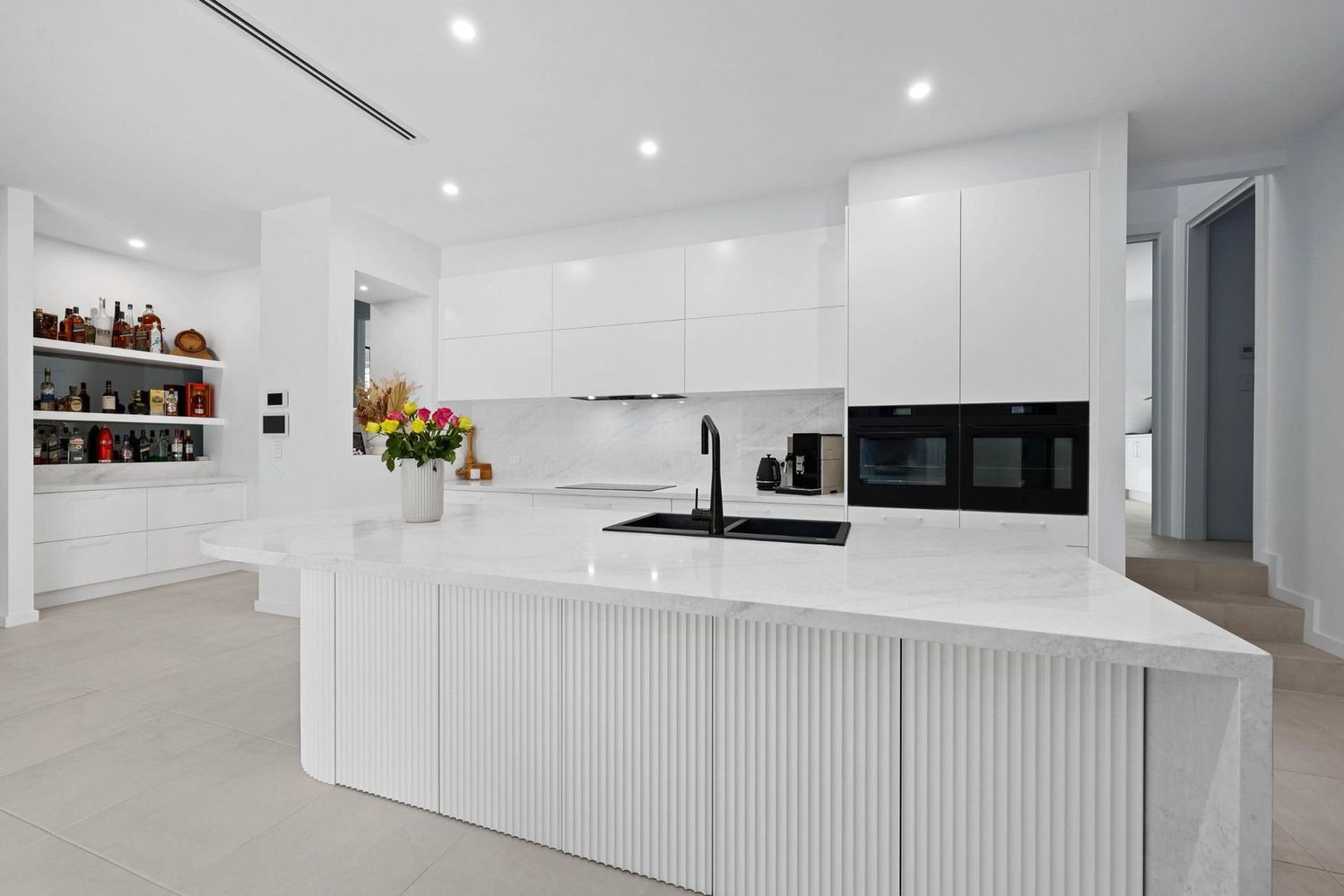 Bright Modern White Kitchen With Island — Above & Beyond Interiors in Smeaton Grange, NSW