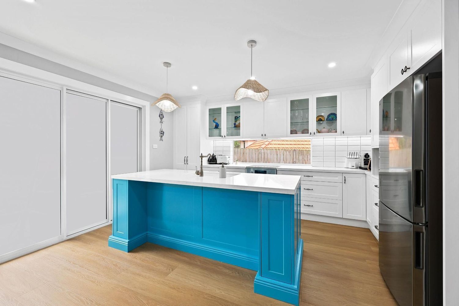 Bright Kitchen With White Cabinets, Black Fridge — Above & Beyond Interiors in Smeaton Grange, NSW