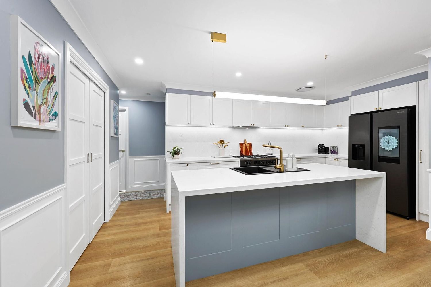 Bright Modern Kitchen With White Cabinets — Above & Beyond Interiors in Smeaton Grange, NSW