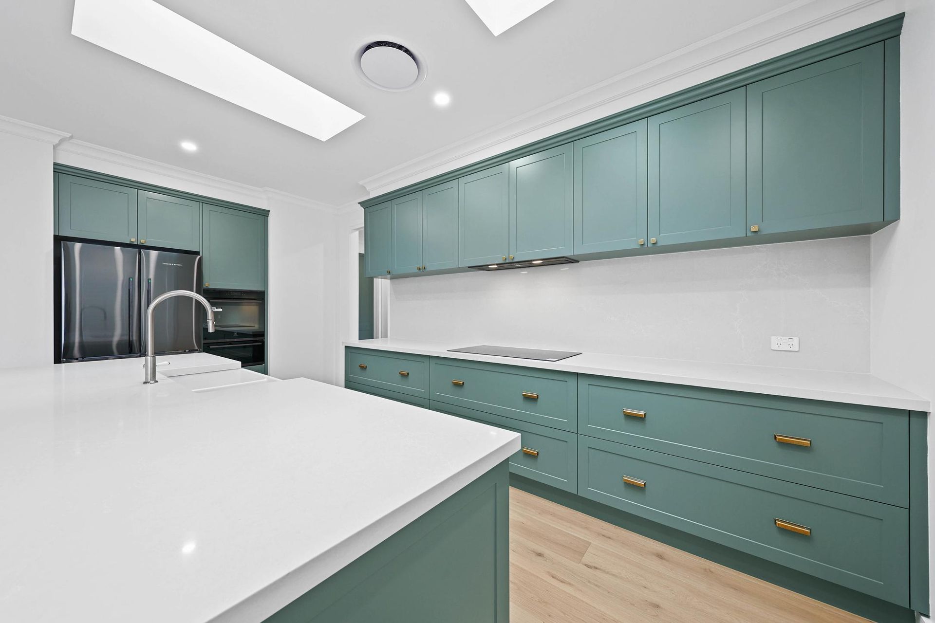 Modern Kitchen With Teal Cabinets, White Island — Above & Beyond Interiors in Smeaton Grange, NSW