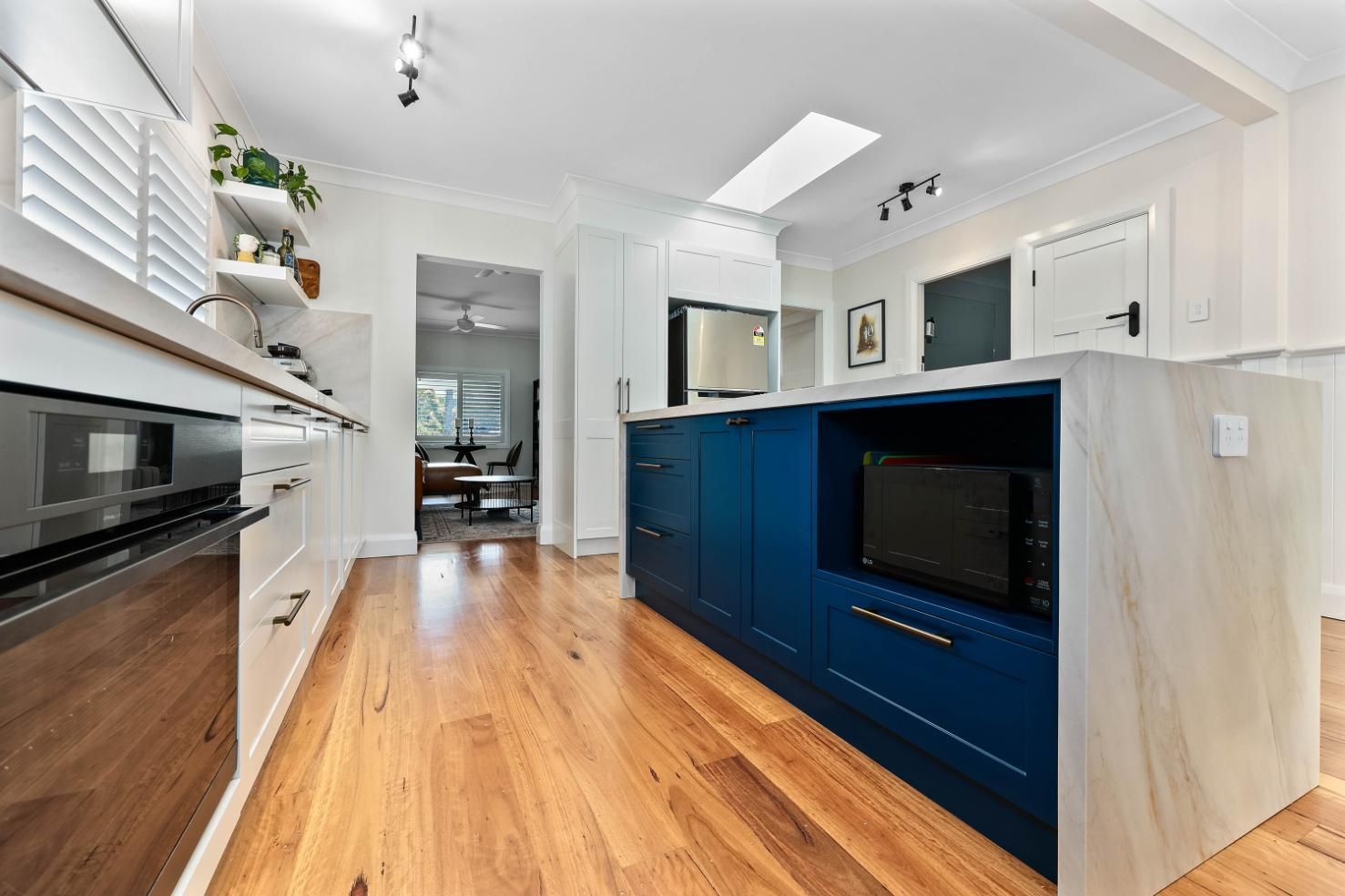 Modern Bright Kitchen With Blue Island — Above & Beyond Interiors in Smeaton Grange, NSW