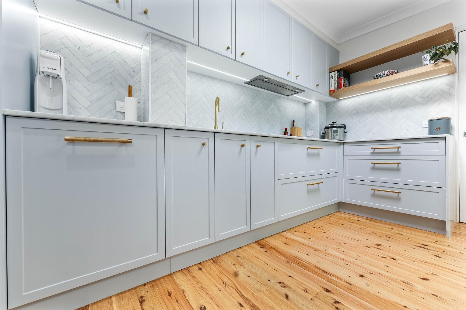Bright Modern White Kitchen With Gold Handles — Above & Beyond Interiors in Smeaton Grange, NSW