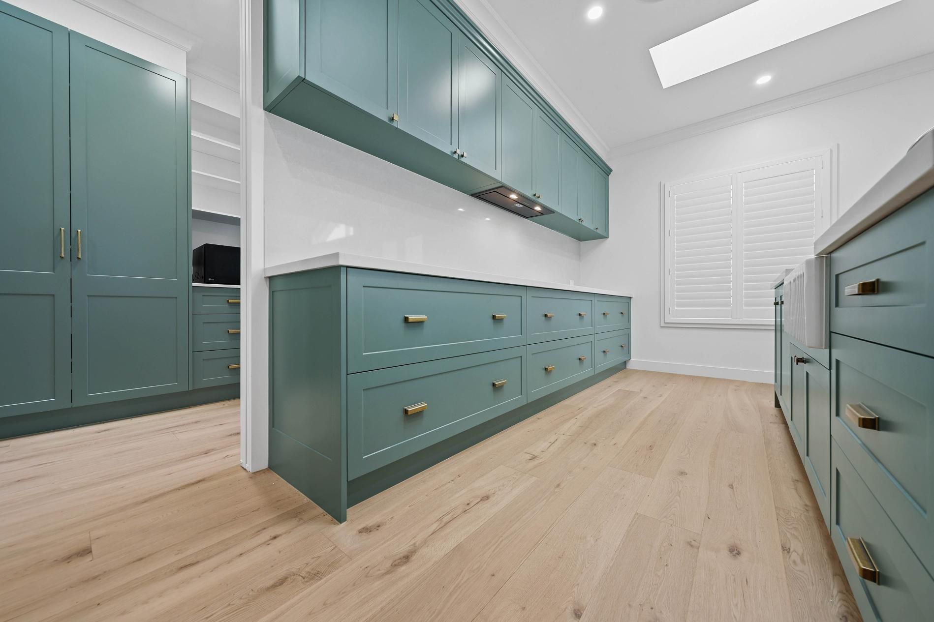 Built-in Teal Cabinetry and Drawers in a Bright — Above & Beyond Interiors in Smeaton Grange, NSW