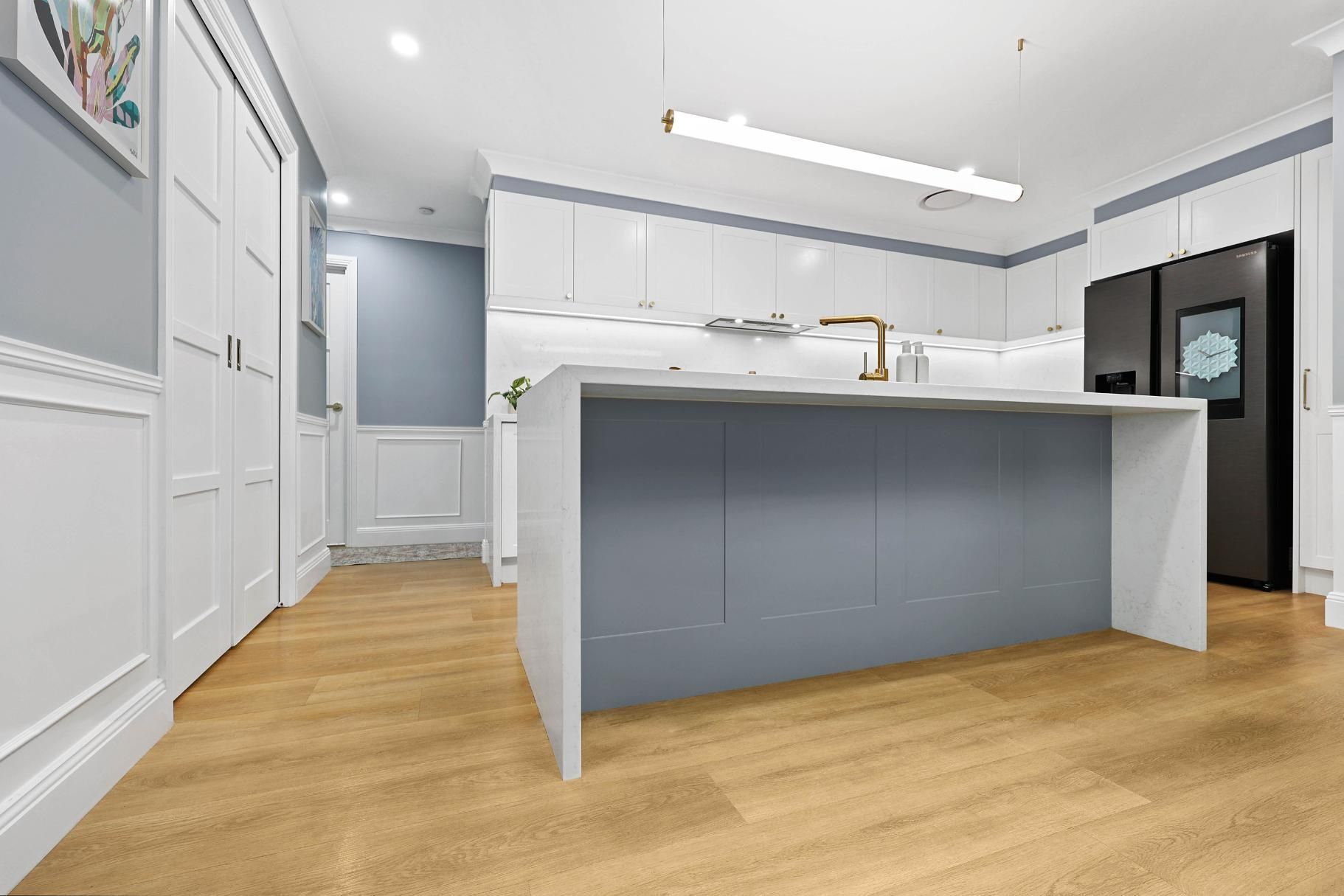 Bright Modern Kitchen With White Cabinets — Above & Beyond Interiors in Smeaton Grange, NSW