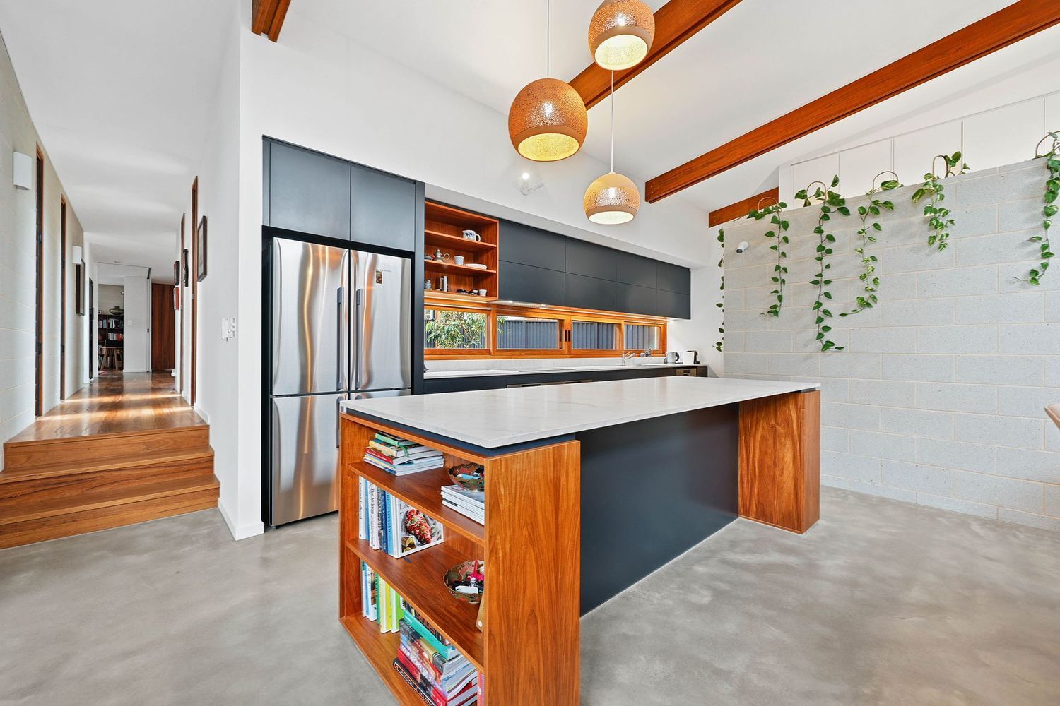 Modern Kitchen With Black Island, Wood Accents — Above & Beyond Interiors in Smeaton Grange, NSW